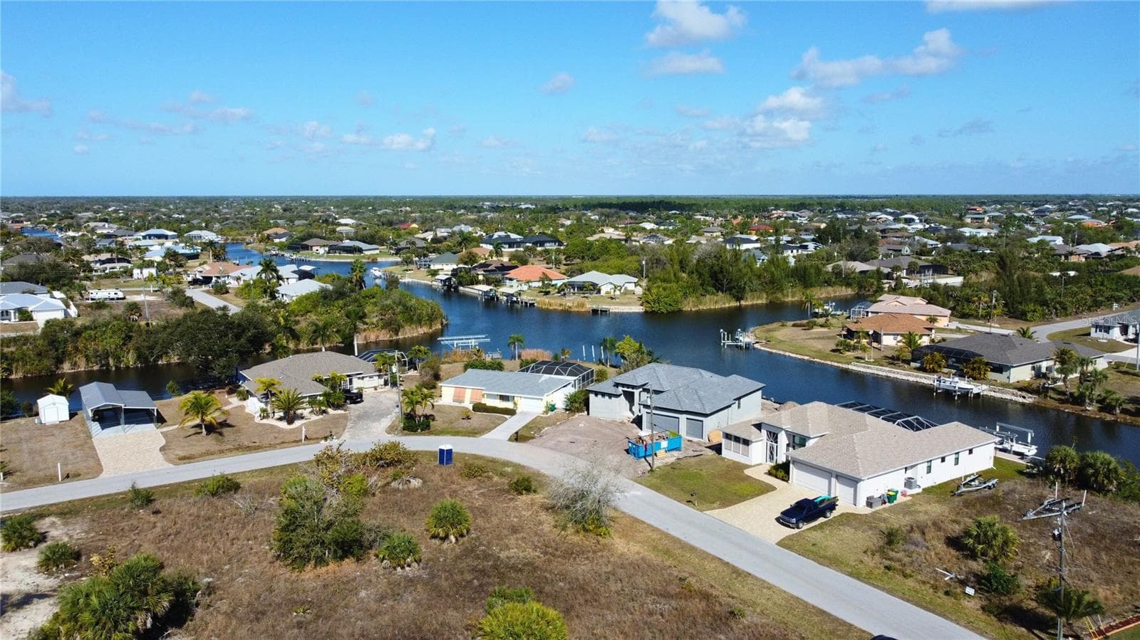 Aerial view of residential area with a large body of water - 9548 ATTICA CIR, PORT CHARLOTTE