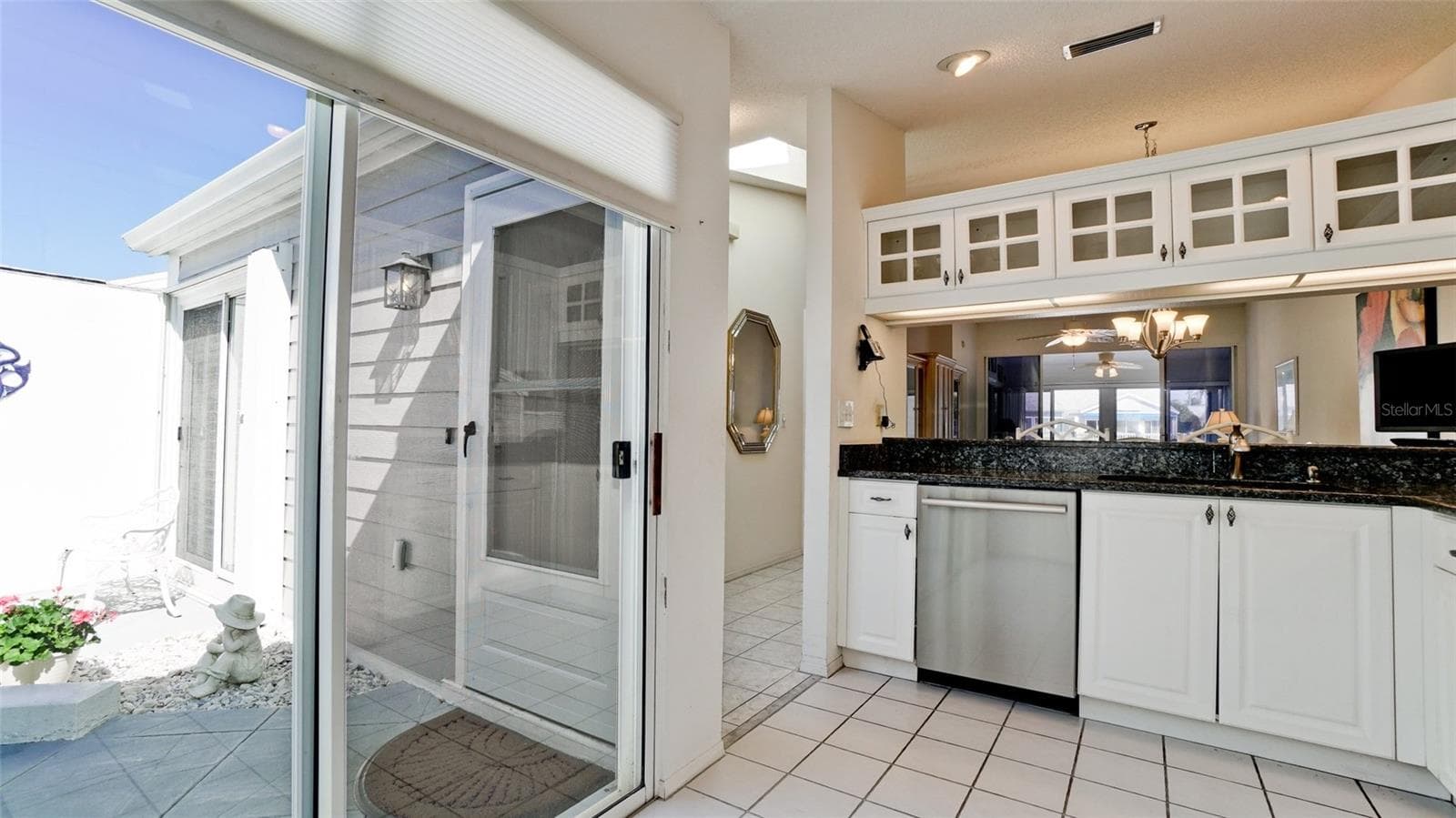 SLIDER LEADING TO COURTYARD - 507 SANDERLING CIR, BRADENTON