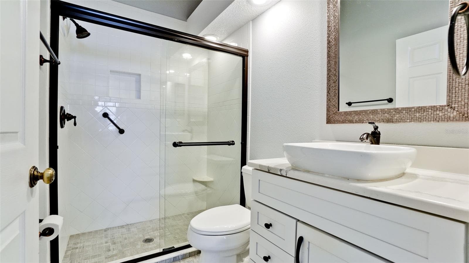 UPDATED MASTER BATHROOM WALK IN SHOWER - 507 SANDERLING CIR, BRADENTON