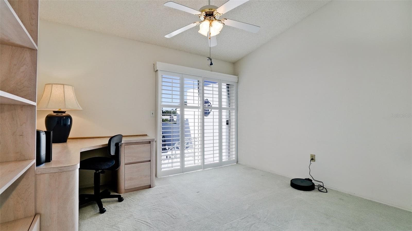 SECOND BEDROOM HAS OFFICE FURNITURE & WHITE PLANTATION SHUTTERS - 507 SANDERLING CIR, BRADENTON