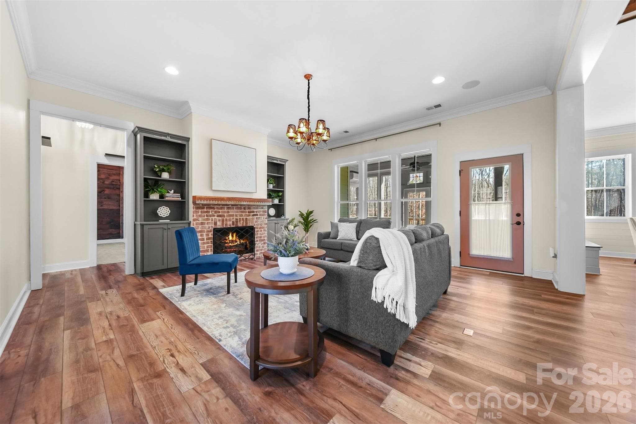 Great room with built in bookshelves and gas log fire place - Lincolnton