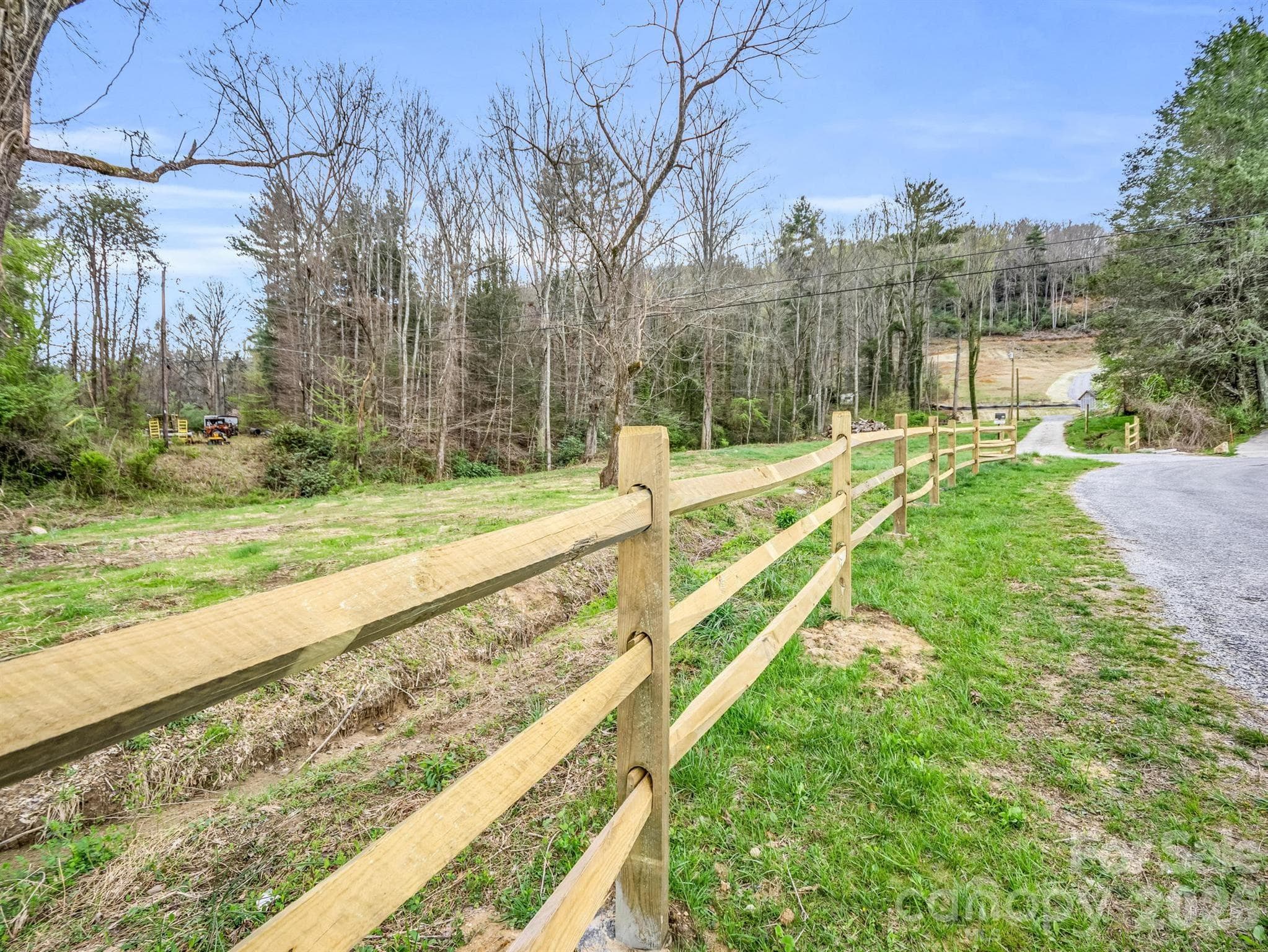Fence added along road leading to property - Hendersonville