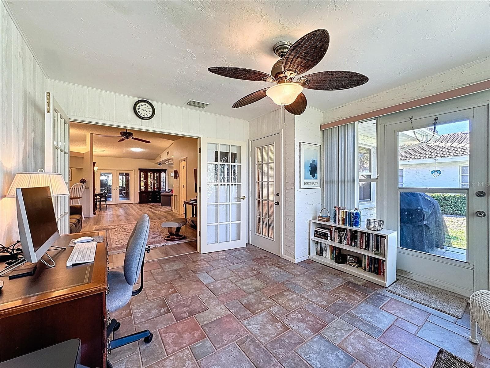 Door to the right leads onto the concrete patio. - 5611 GARDEN LAKES DR, BRADENTON