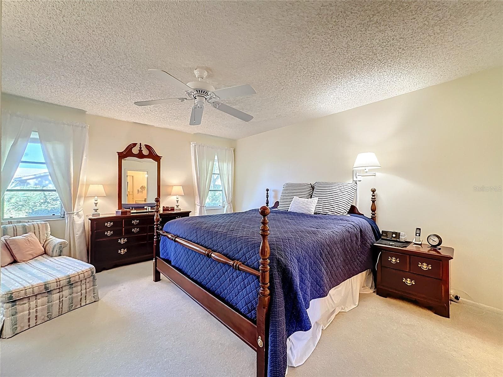 Another view of the spacious primary bedroom. - 5611 GARDEN LAKES DR, BRADENTON