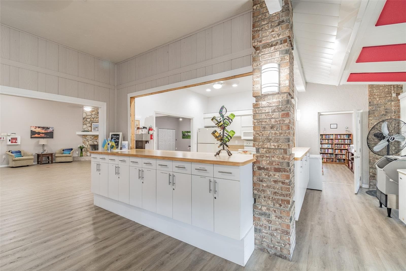 Kitchen with a view of the library in the background. - 5611 GARDEN LAKES DR, BRADENTON