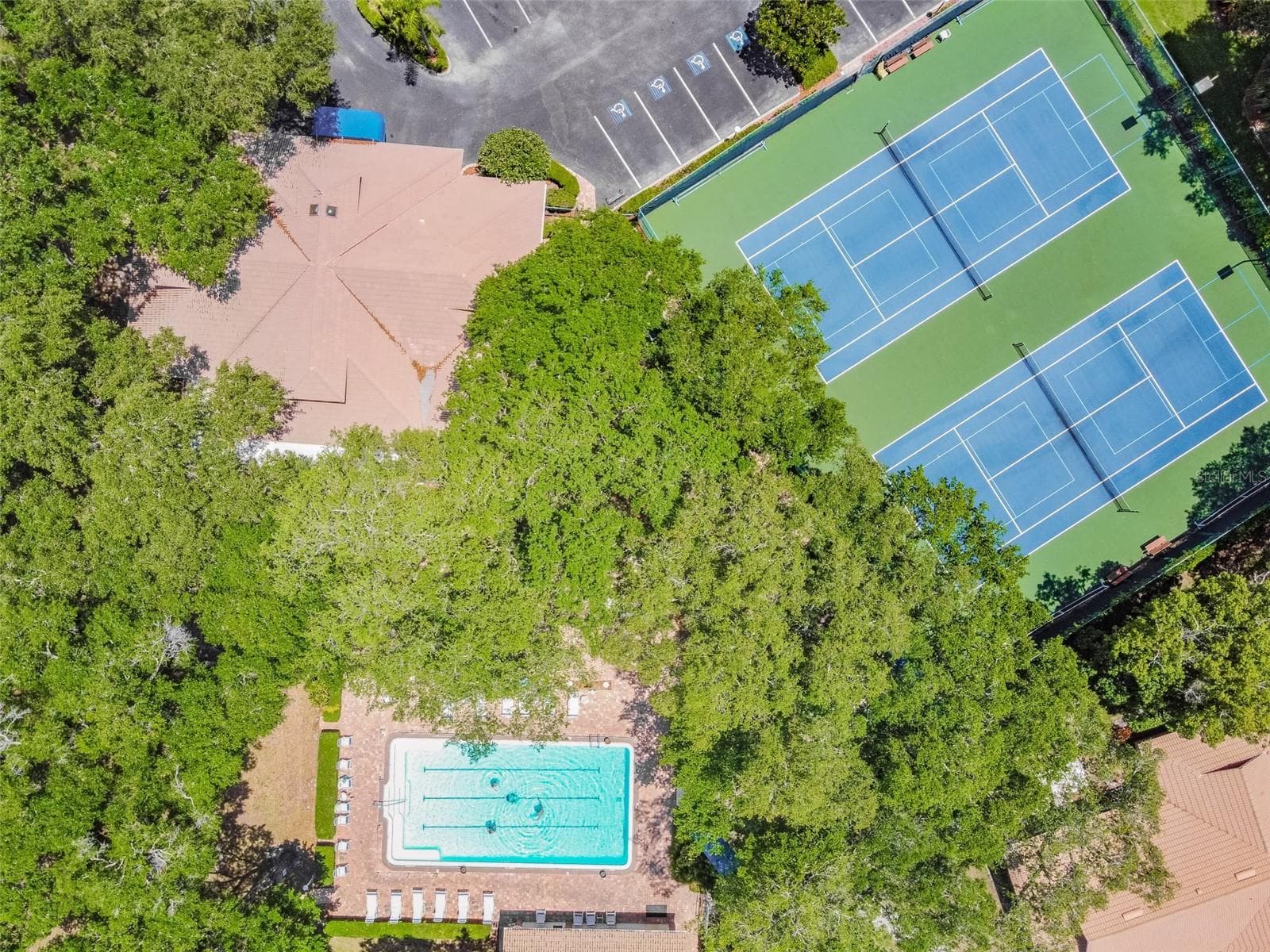 Aerial of the pool and tennis/pickleball courts. - 5611 GARDEN LAKES DR, BRADENTON