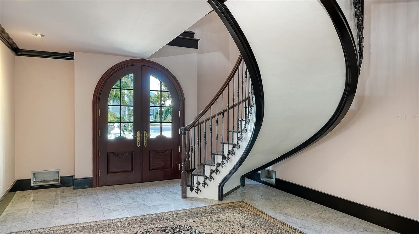 Dramatic curved staircase and entryway - 513 VILLA ROSA WAY, ANNA MARIA