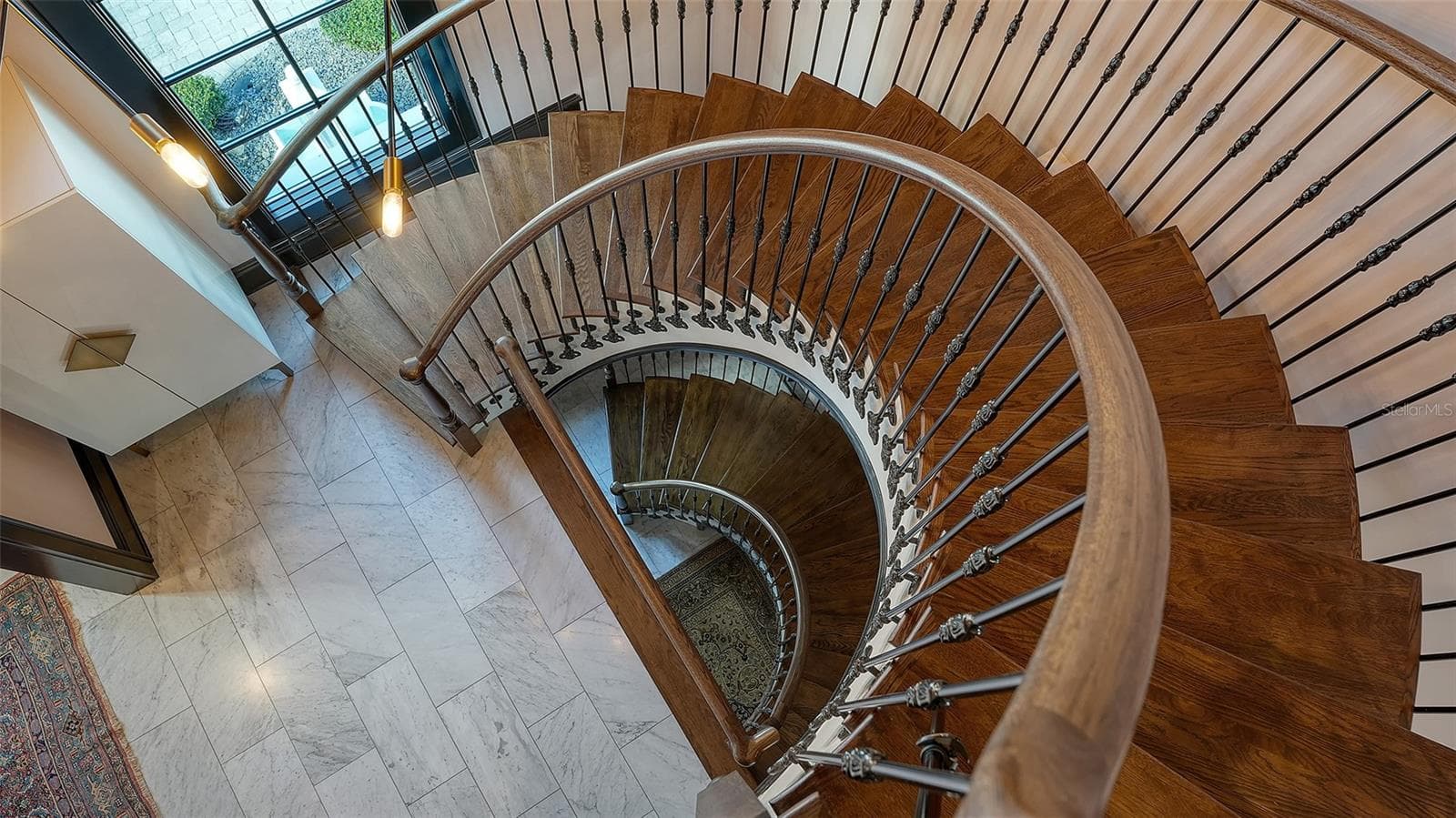 Custom spiral staircase with artisan ironwork - 513 VILLA ROSA WAY, ANNA MARIA