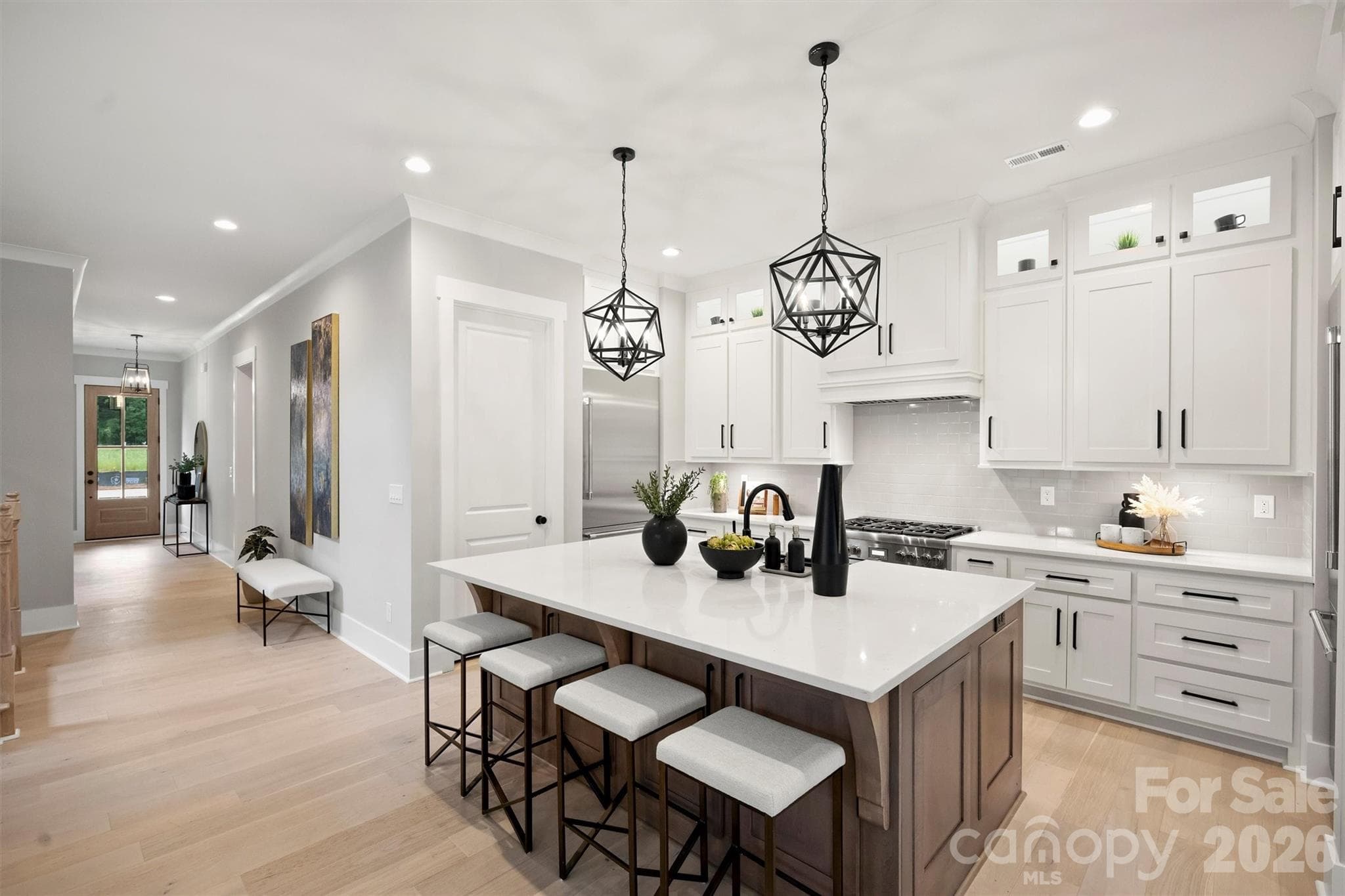 Lower cabinets in front of bar stools for wonderful storage! - 8163 Fairview Road, Charlotte