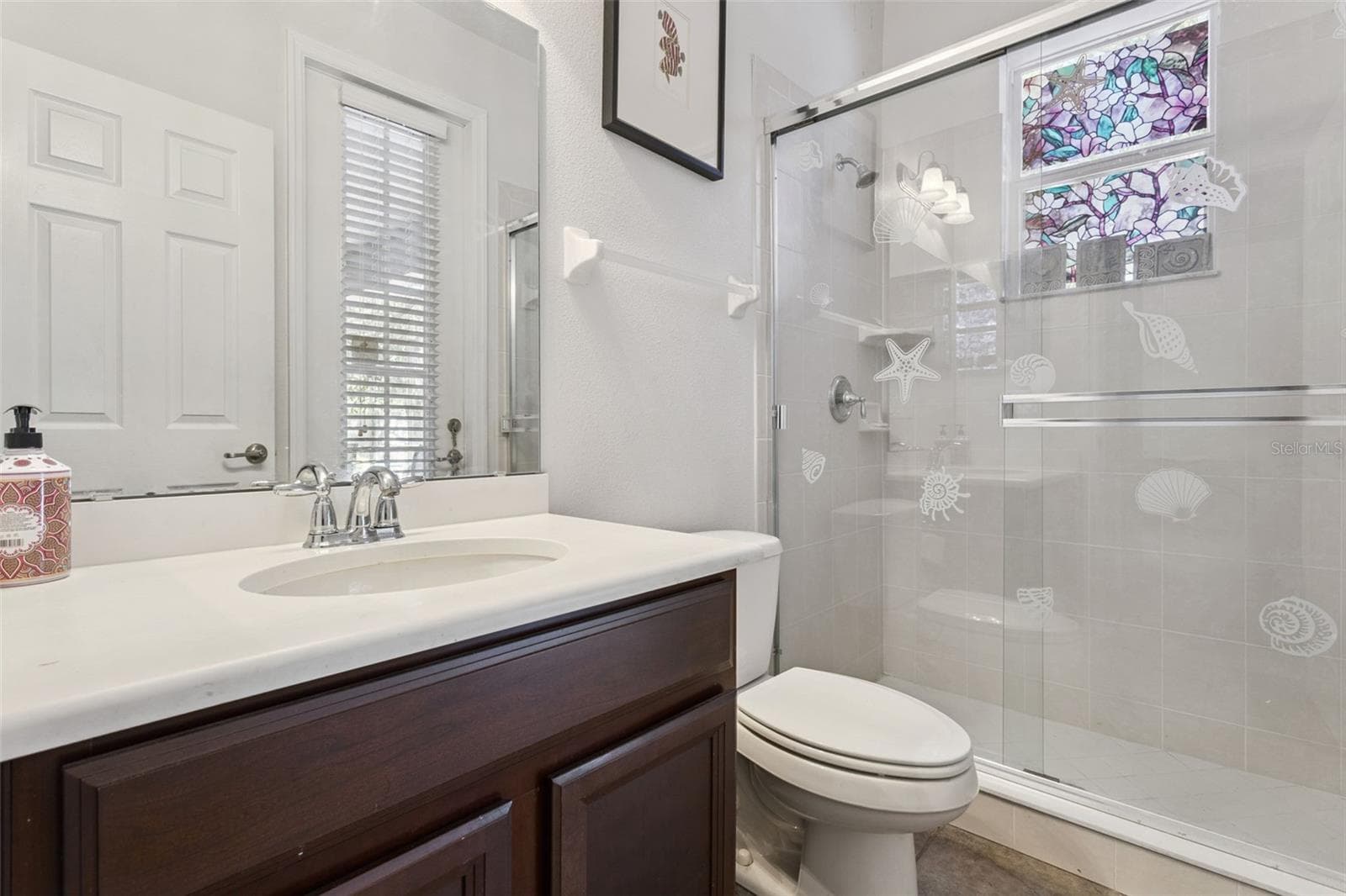 Guest bathroom #3 with walk-in shower and access to pool area - 30337 GIDRAN TER, MOUNT DORA
