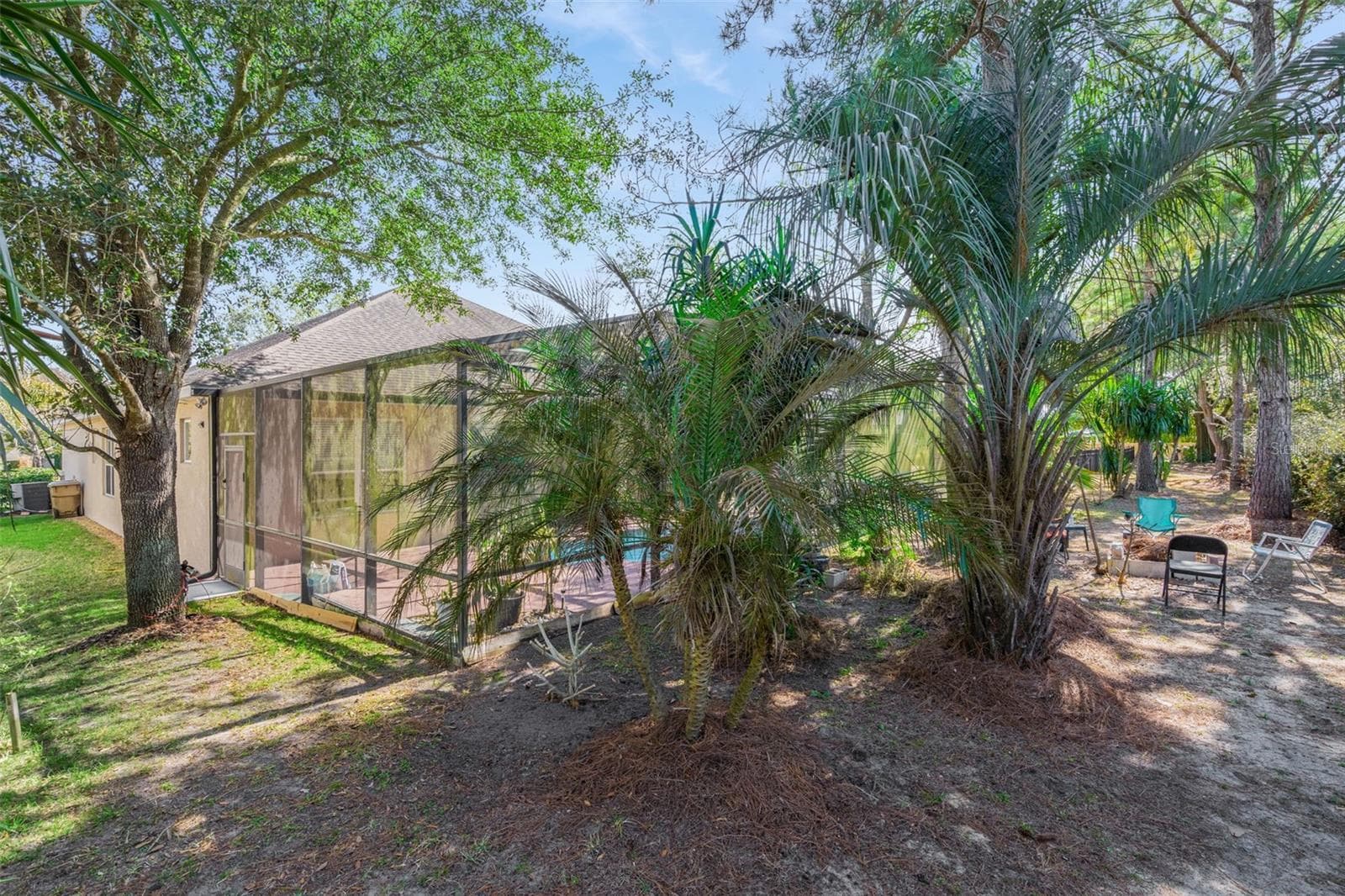 Rear yard view emphasizing privacy and usable outdoor space - 30337 GIDRAN TER, MOUNT DORA