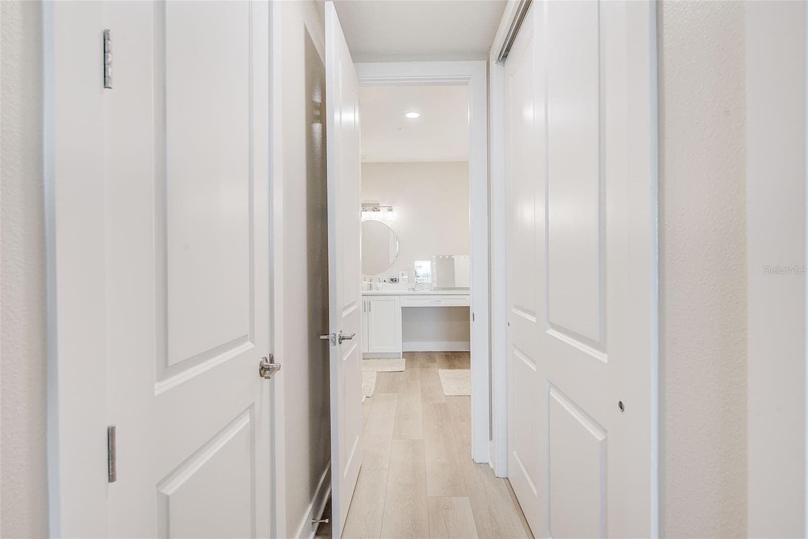 Closets between primary bedroom and primary bath. - 400 150TH AVE #504, MADEIRA BEACH