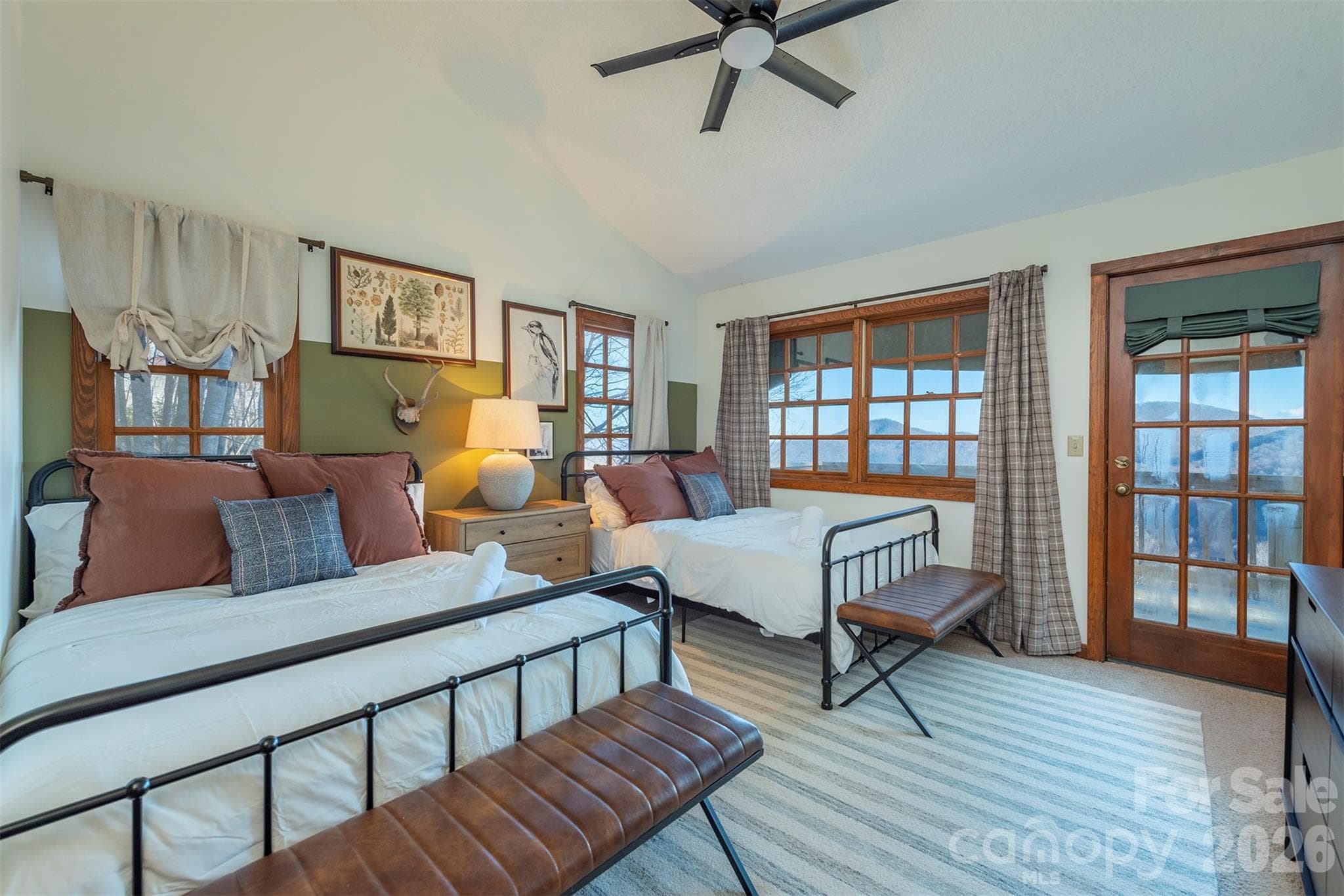 BR#2 Main floor guest bedroom. Double the beds, double the comfort. No need to flip a coin—everyone gets their own cozy spot to crash after a day of adventures. - Mars Hill