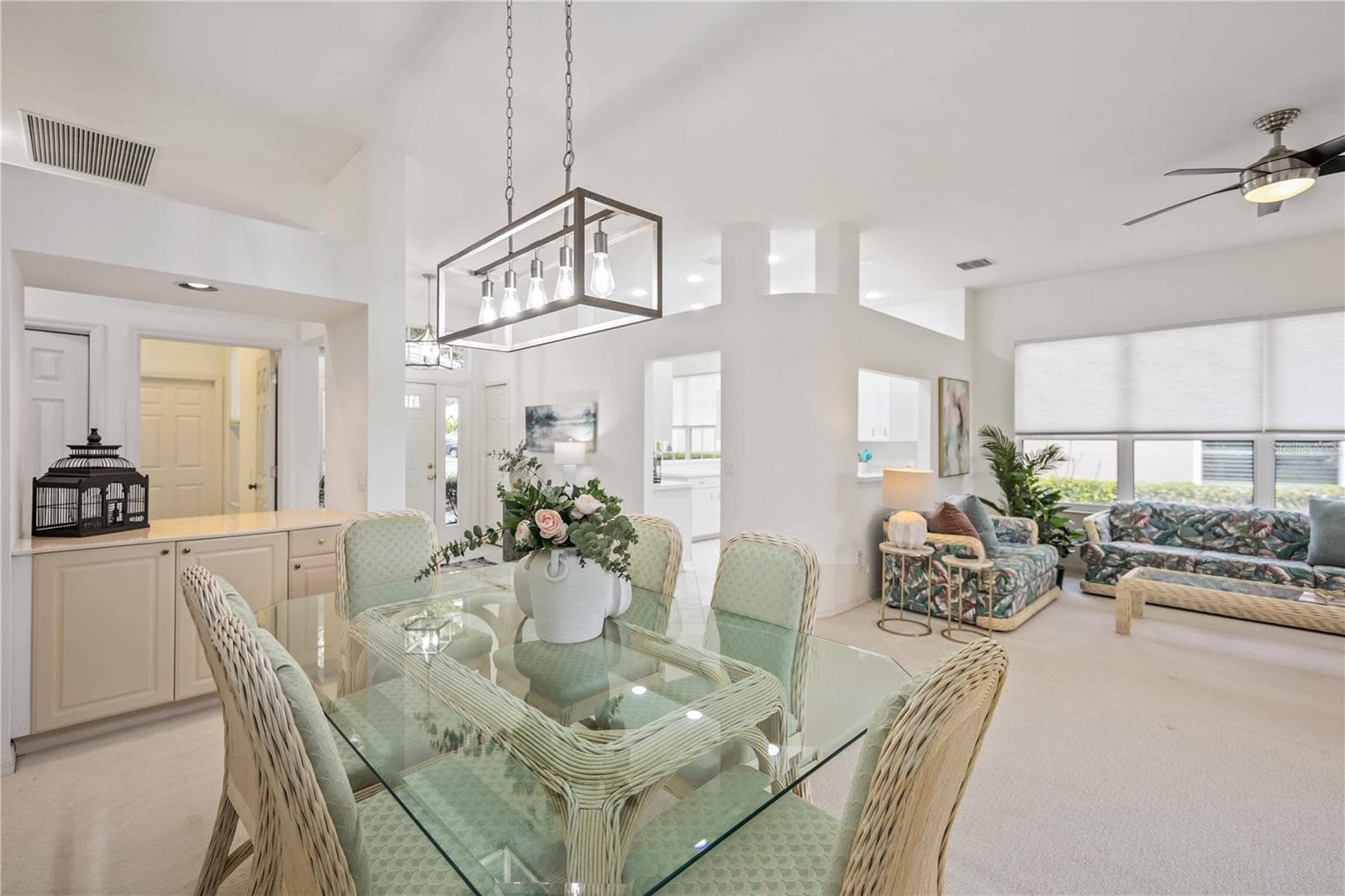 Dining room and foyer lights and living room fan - all new.  Furniture comes with the home.  Move in ready.  Staging available for purchase. - 547 FALLBROOK DR, VENICE