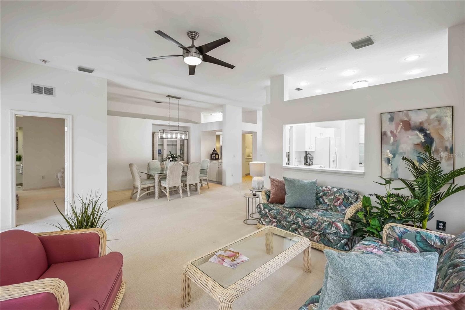 Dining room  and living room - entry to primary bedroom/ensuite - 547 FALLBROOK DR, VENICE