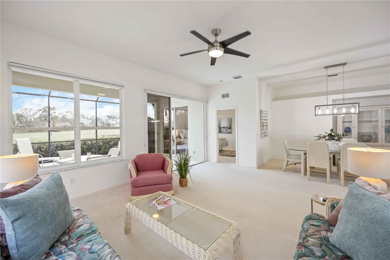 Dining, Living Room, Primary Bedroom off the right and lanai - 547 FALLBROOK DR, VENICE