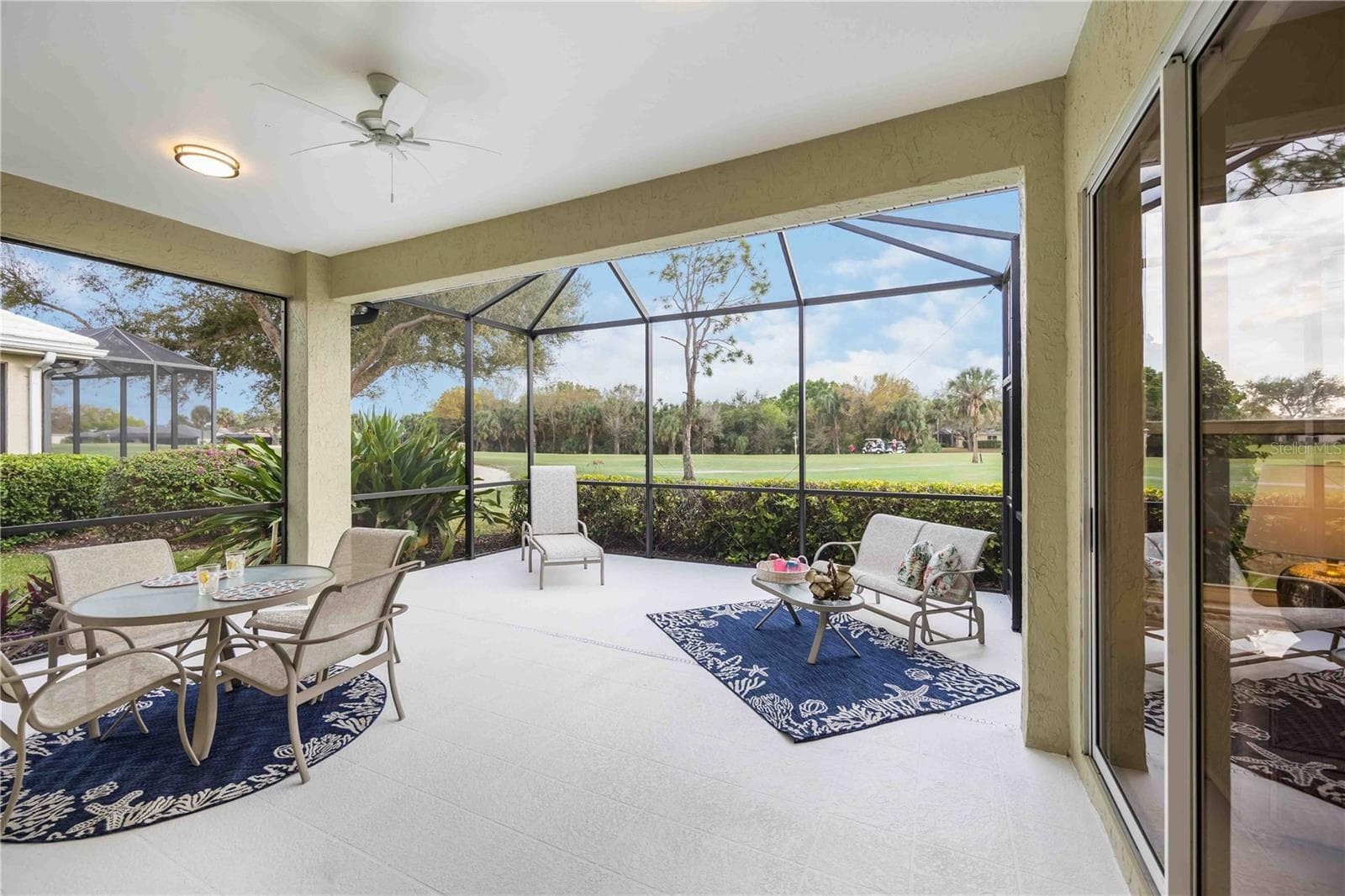 Extended lanai is freshly painted and overlooks the golf course and pond - sliding doors from primary to the lanai - 547 FALLBROOK DR, VENICE