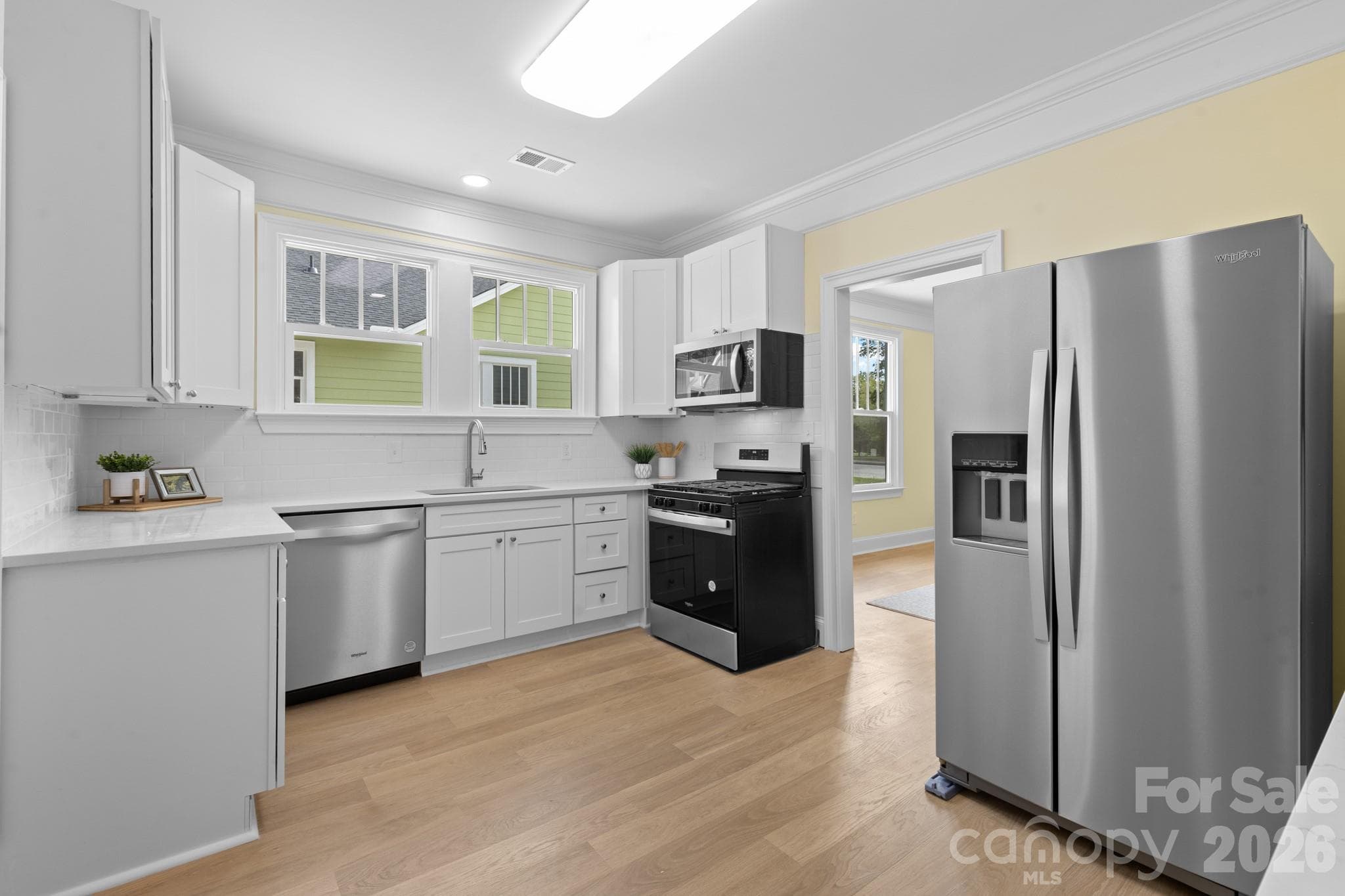Kitchen with quartz countertops and subway tile backsplash - Lancaster
