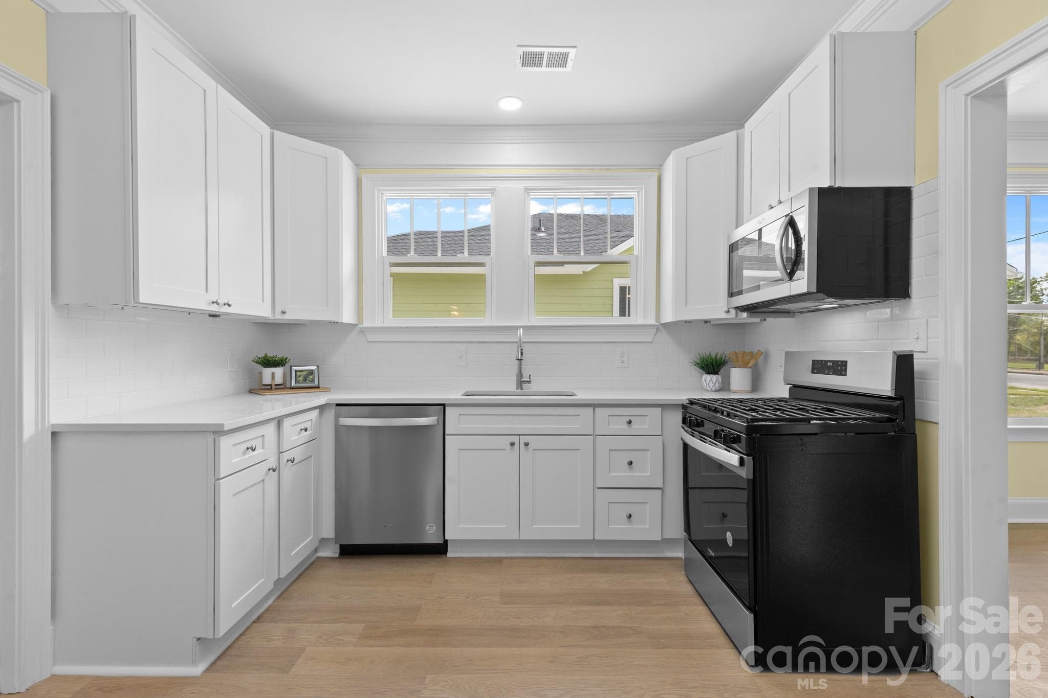 Kitchen with quartz countertops and subway tile backsplash - Lancaster