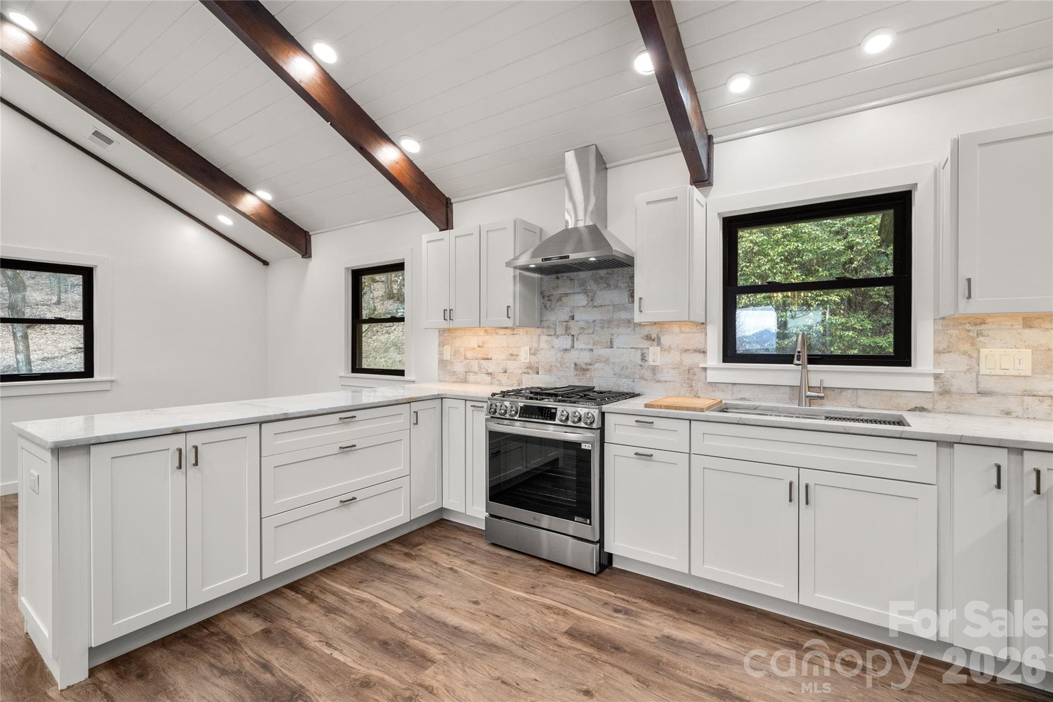 Completely renovated kitchen with custom cabinetry and new appliances. - Waynesville