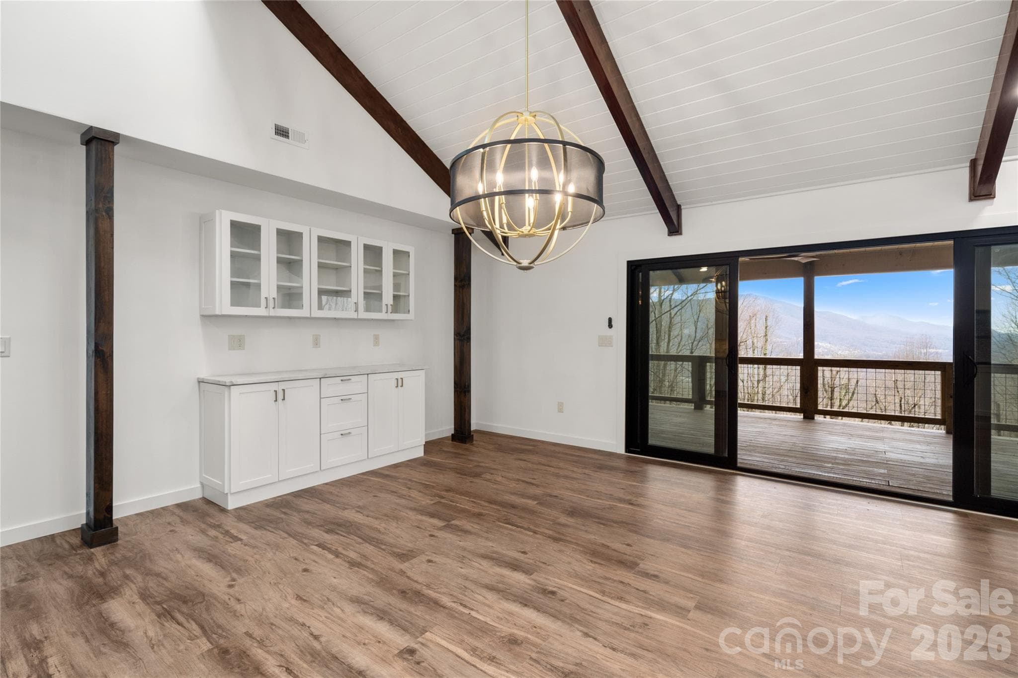Open dining and living with built in custom cabinets - Waynesville