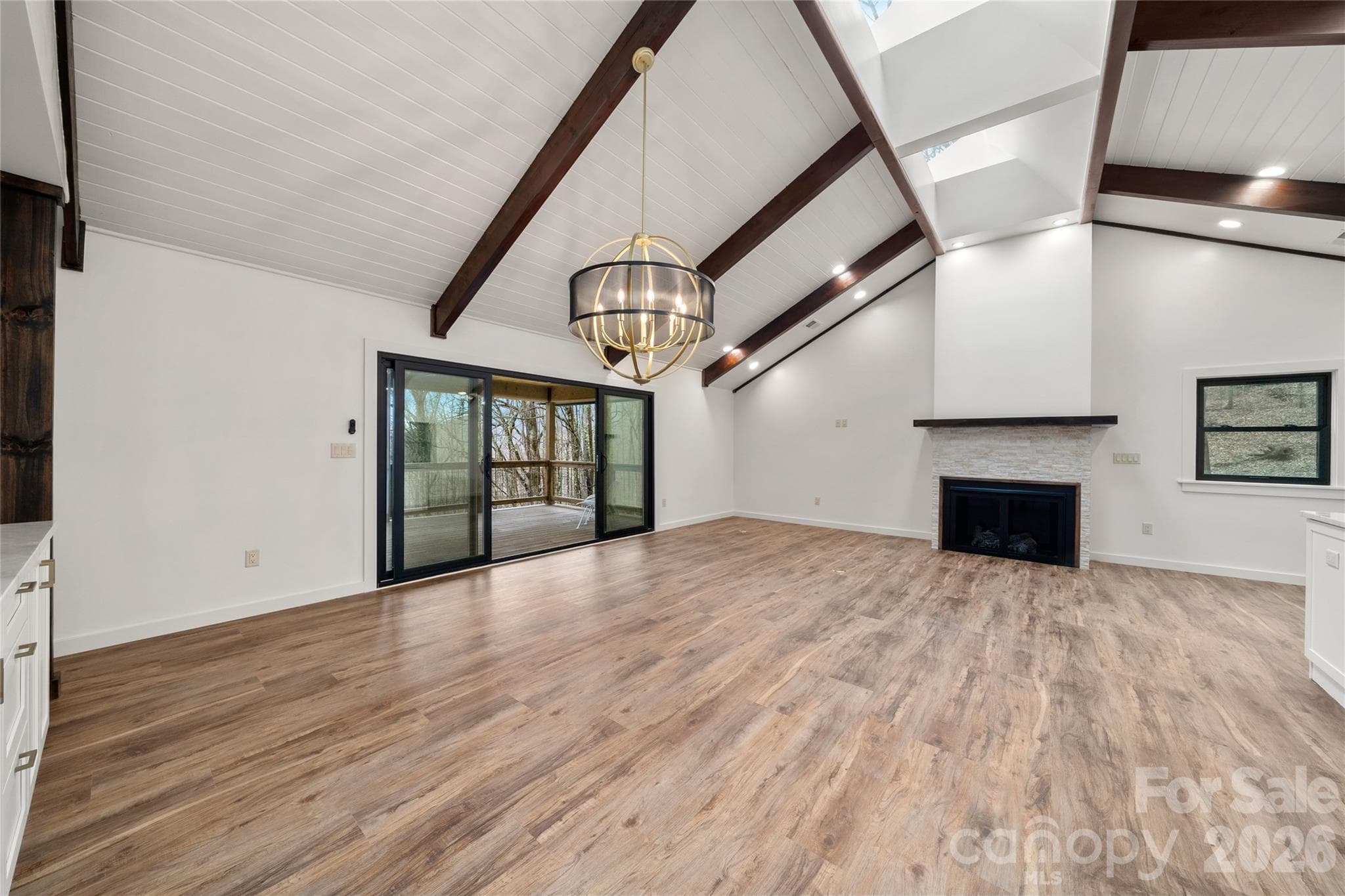 Sliding glass doors to deck, beamed cathedral ceilings - Waynesville