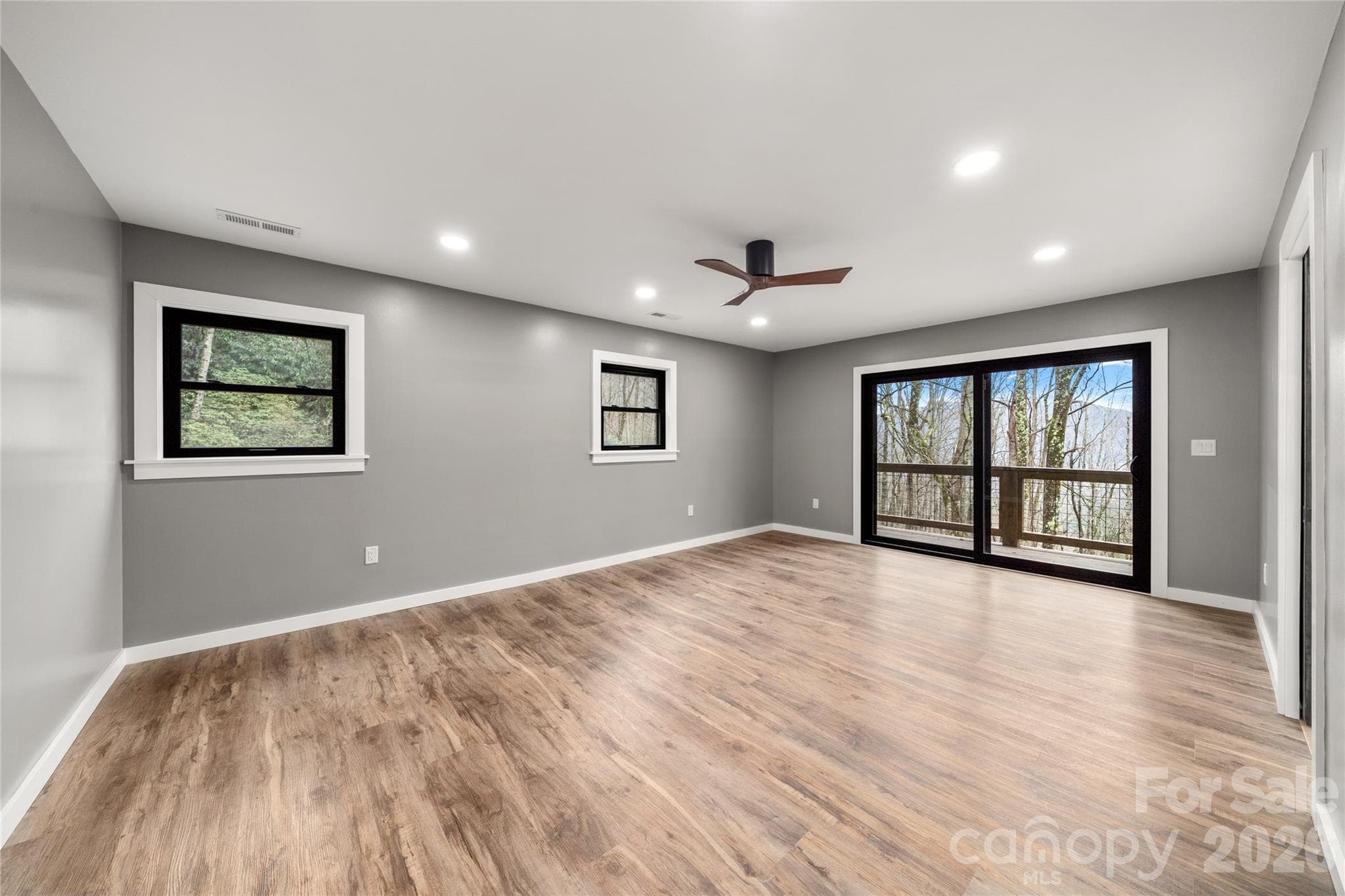 Main level primary bedroom sliding door for fresh mountain air - Waynesville