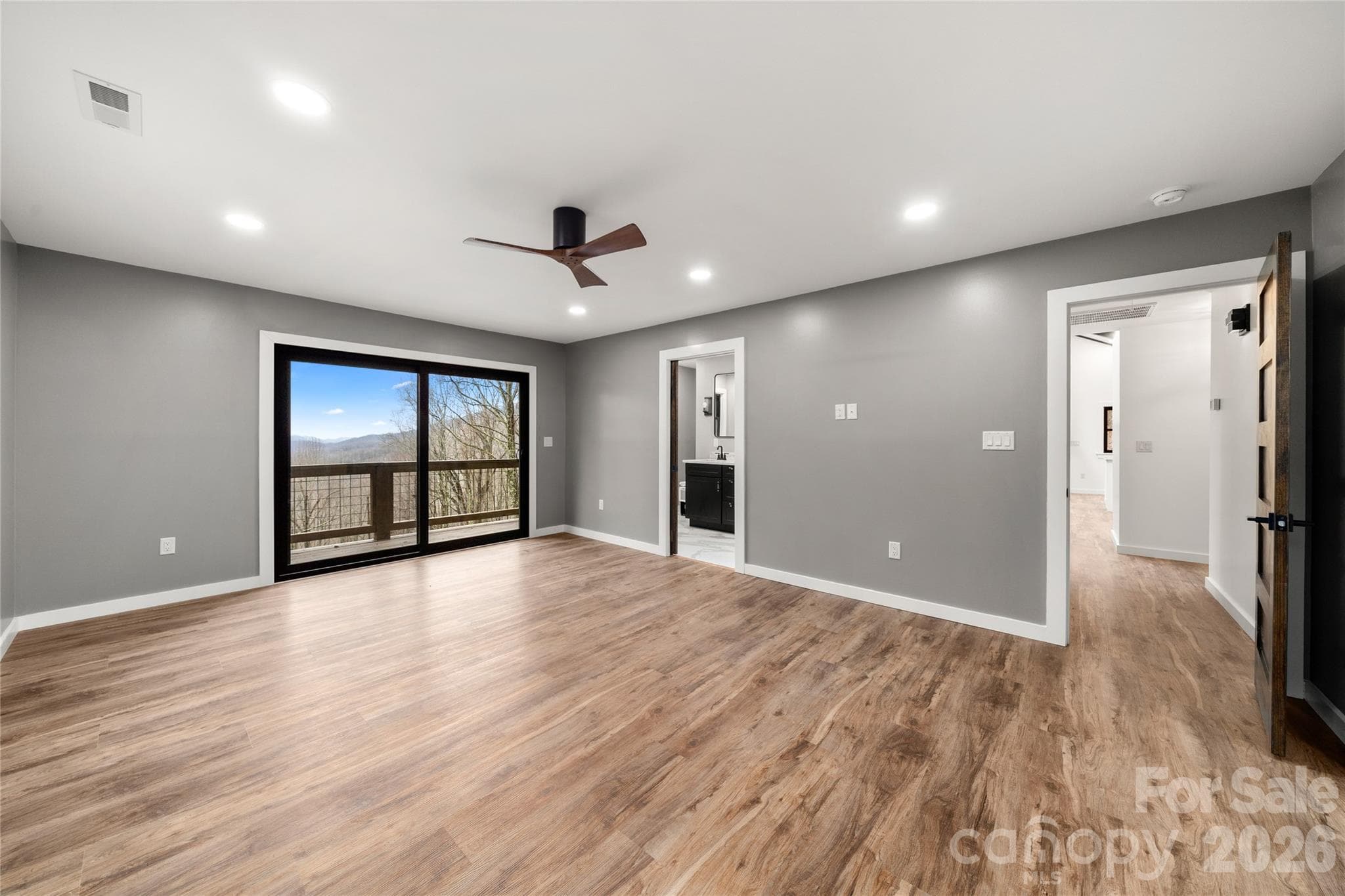 Spacious main level primary suite with fresh paint and new flooring, new lighting - Waynesville