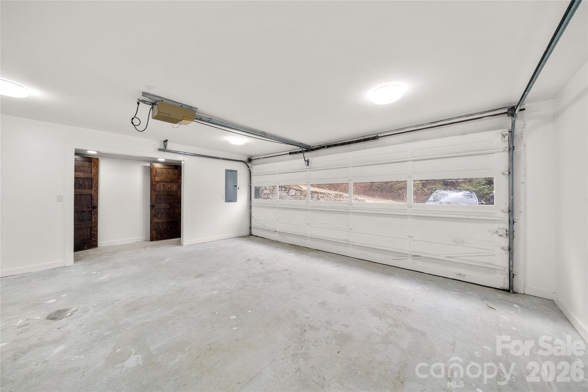 Spacious two-car garage with room for storage and mountain gear. - Waynesville