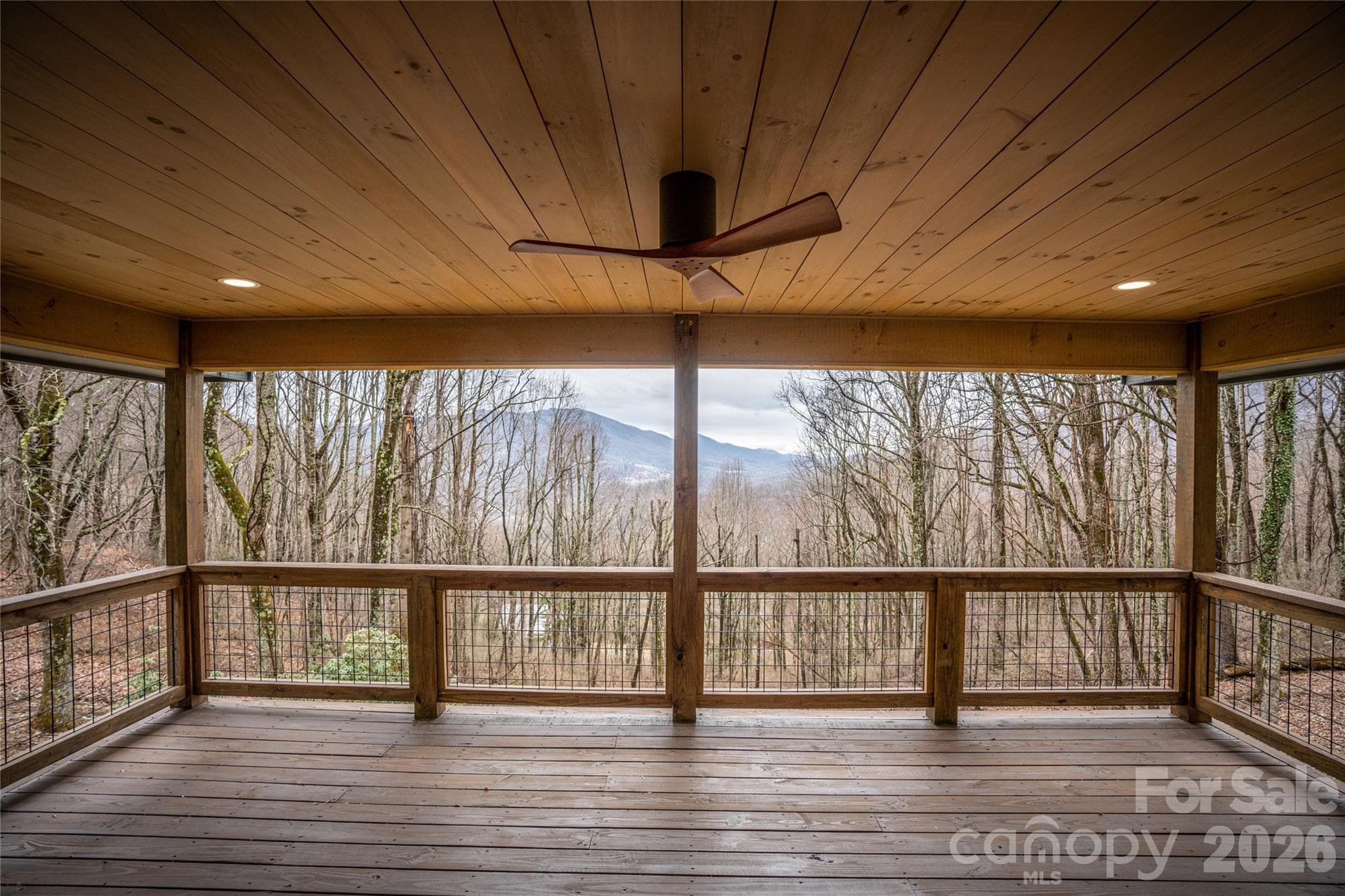 Spacious covered deck—perfect for year-round outdoor living and entertaining. - Waynesville