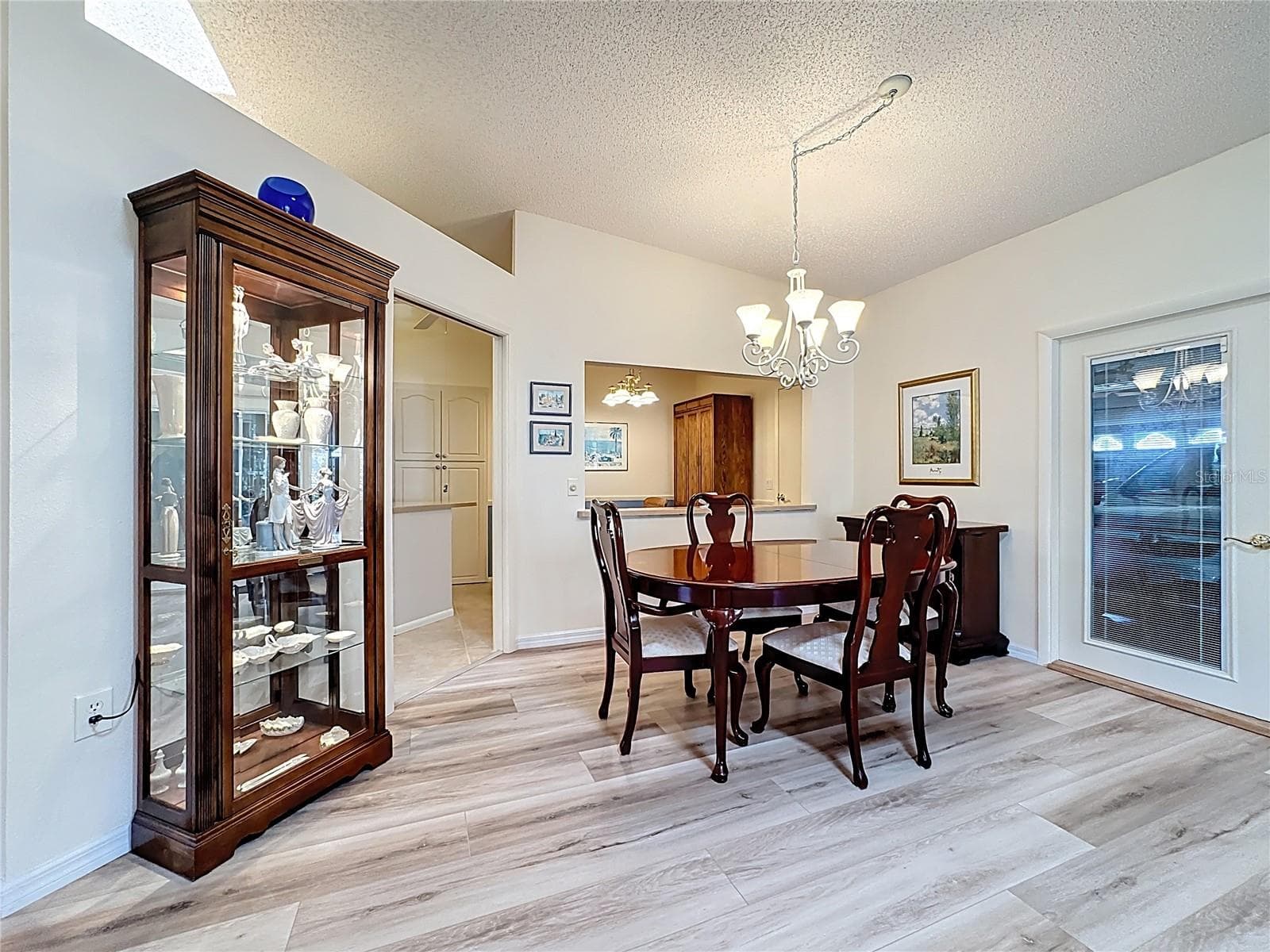 Another view of the dining room and French door to garage. - 5611 GARDEN LAKES DR, BRADENTON
