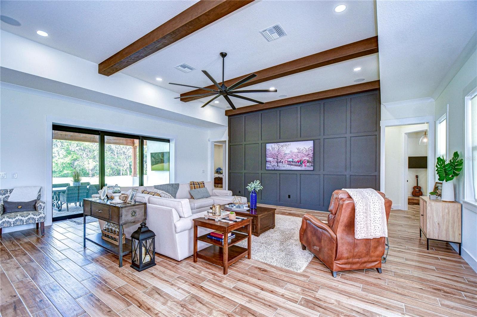 Wood-look tile flooring throughout the main living areas, including the office and primary suite - 111 ALAFIA ESTATES LN, LITHIA