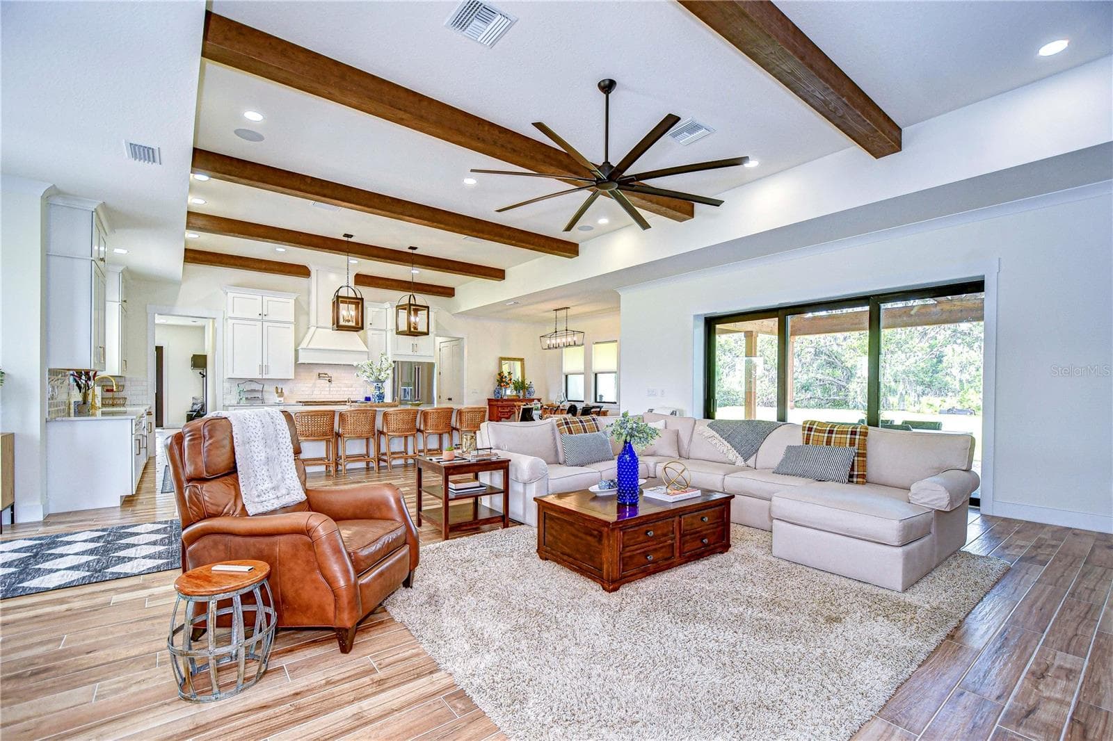 Wood beam accents living room to kitchen - 111 ALAFIA ESTATES LN, LITHIA