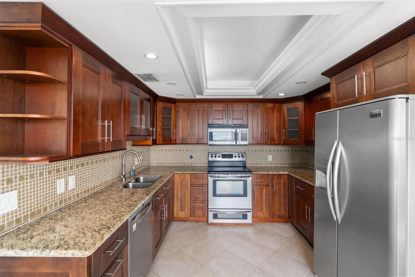 Cherry cabinets with granite countertops - 1501 GULF BLVD #603, CLEARWATER BEACH