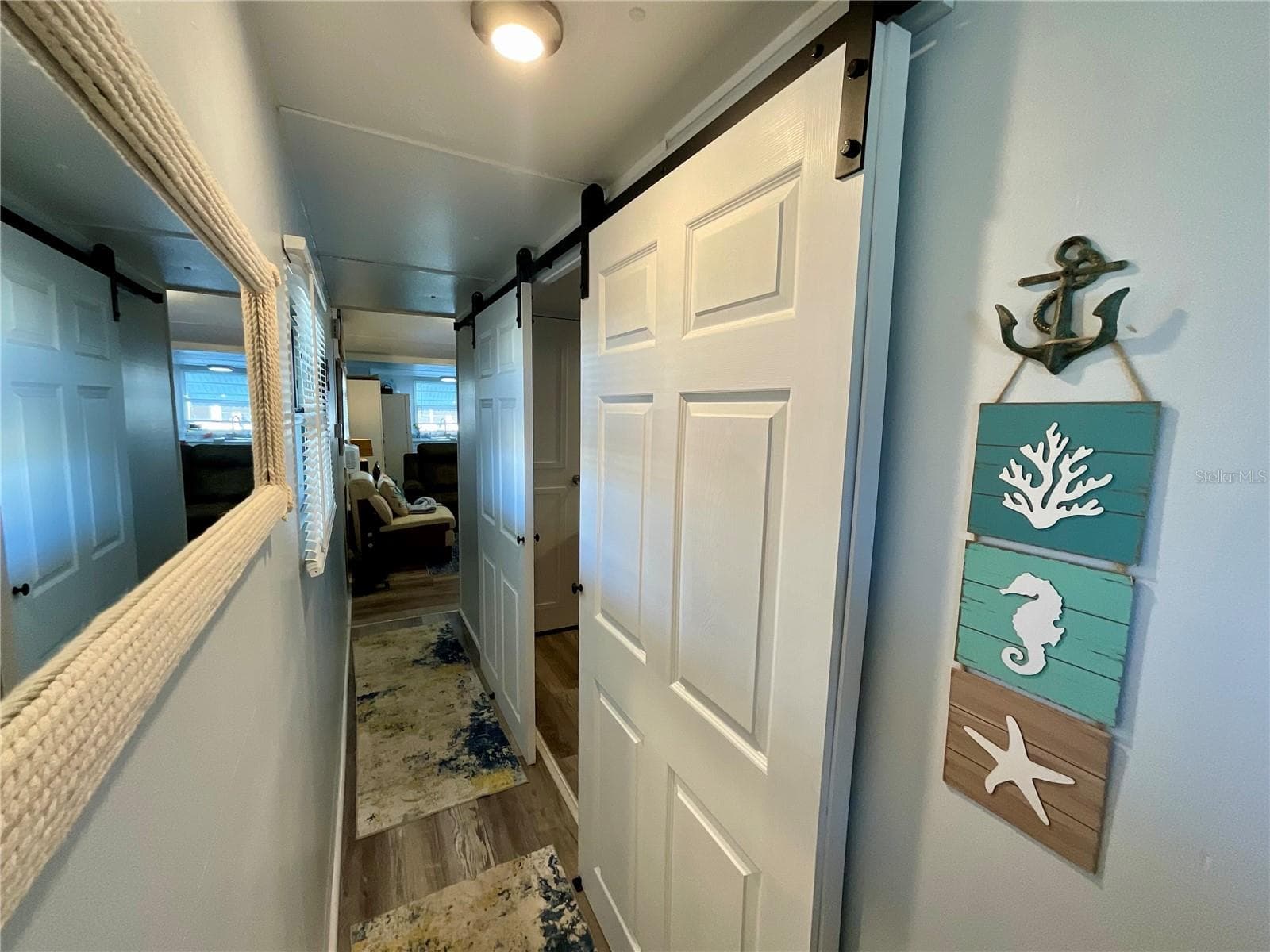 Barn doors added to entrance for Master Bedroom (en-suite bathroom) - 6580 SEMINOLE BLVD #510, SEMINOLE
