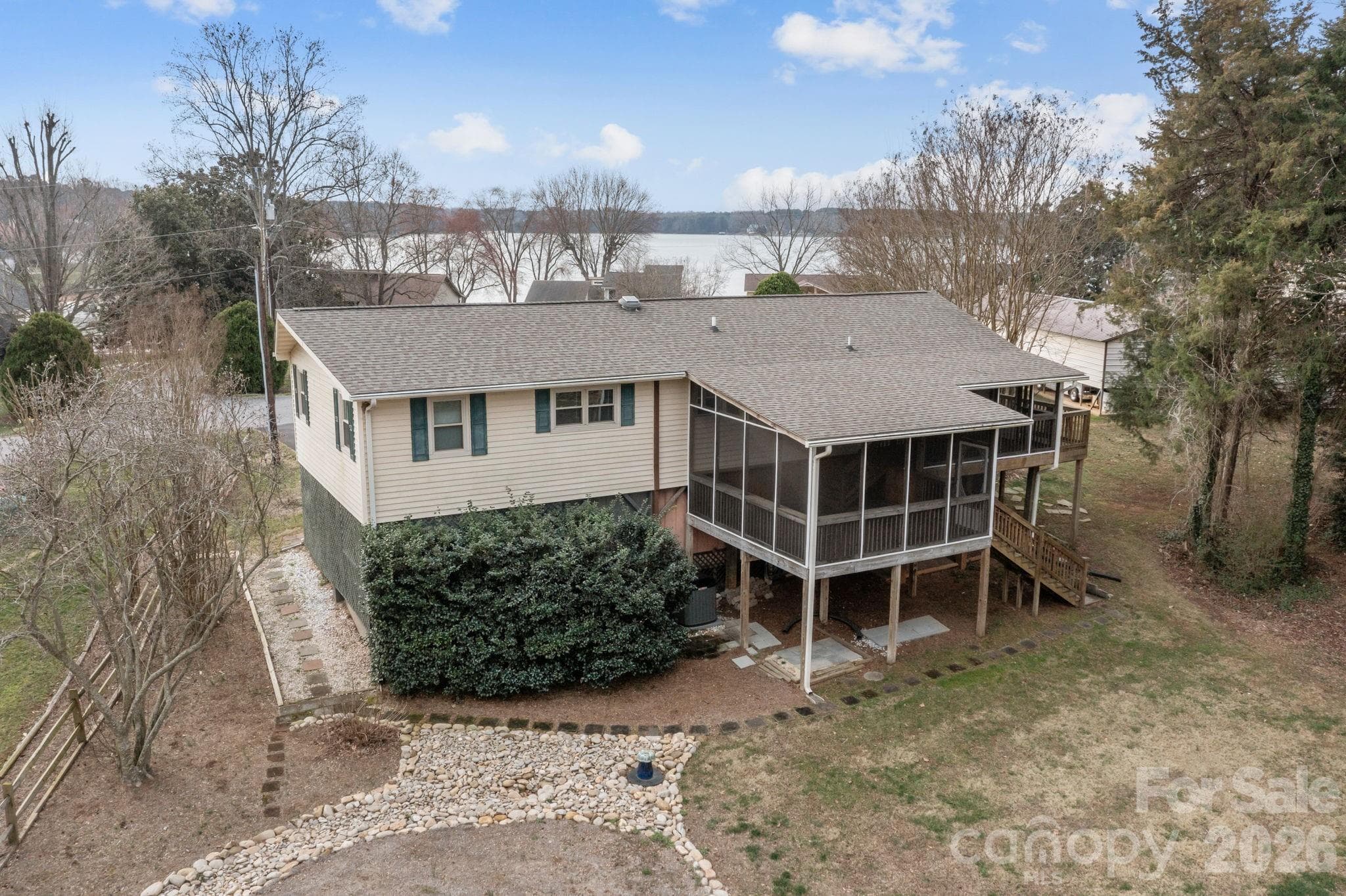 BAck of home. Enjoy time on screened in porches viewing the large back yard with views of the lake certain times of the year! - 4278 Harbor Lane, Sherrills Ford