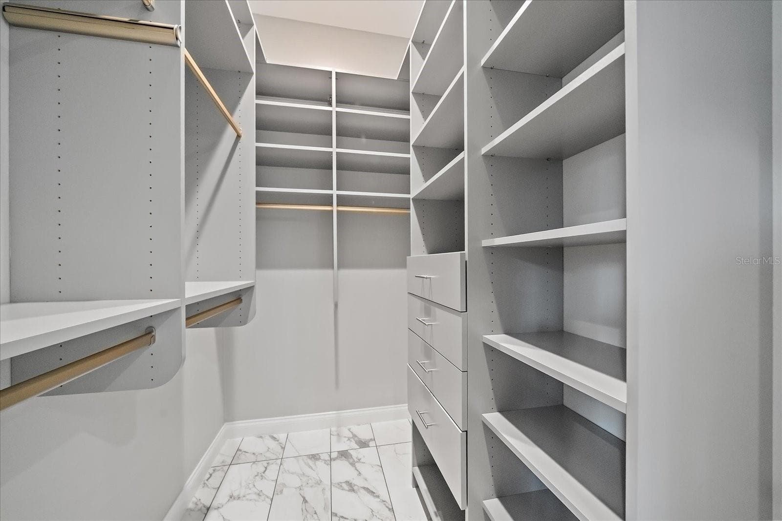 Primary Closets: Dual with custom built-ins 1st Floor - 2207 WISTERIA ST, SARASOTA