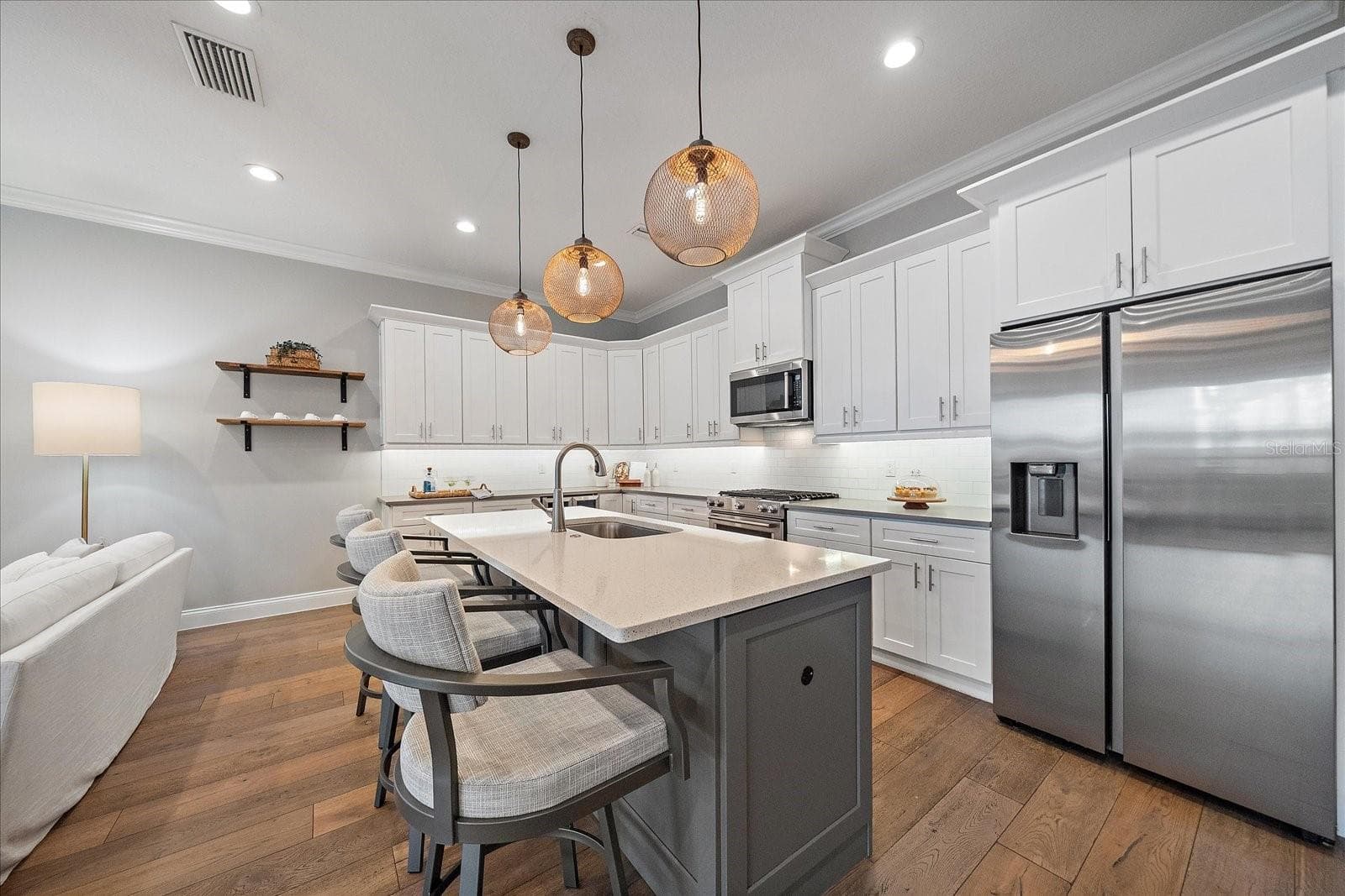 Kitchen with new stainless steel appliances, quartz countertops, wine fridge - 1st Floor - 2207 WISTERIA ST, SARASOTA