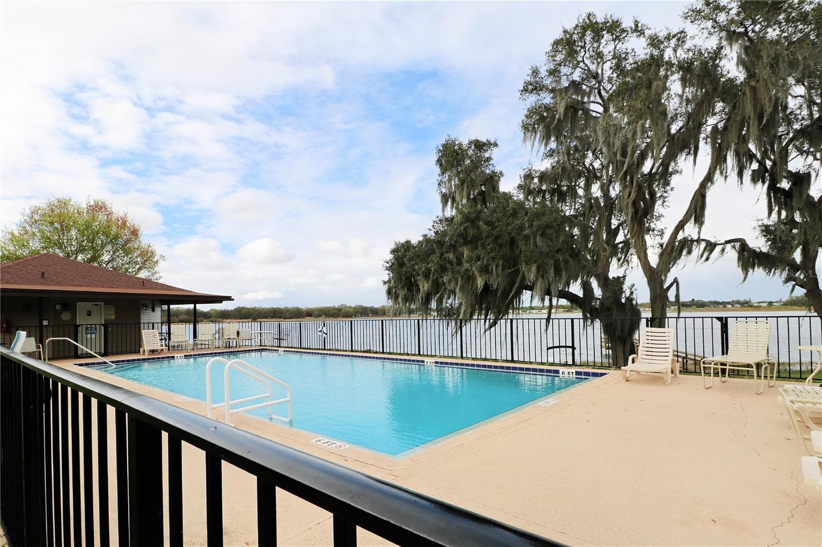 Community pool overlooks Saddlebag Lake - 7350 MIDWAY LN #54, LAKE WALES