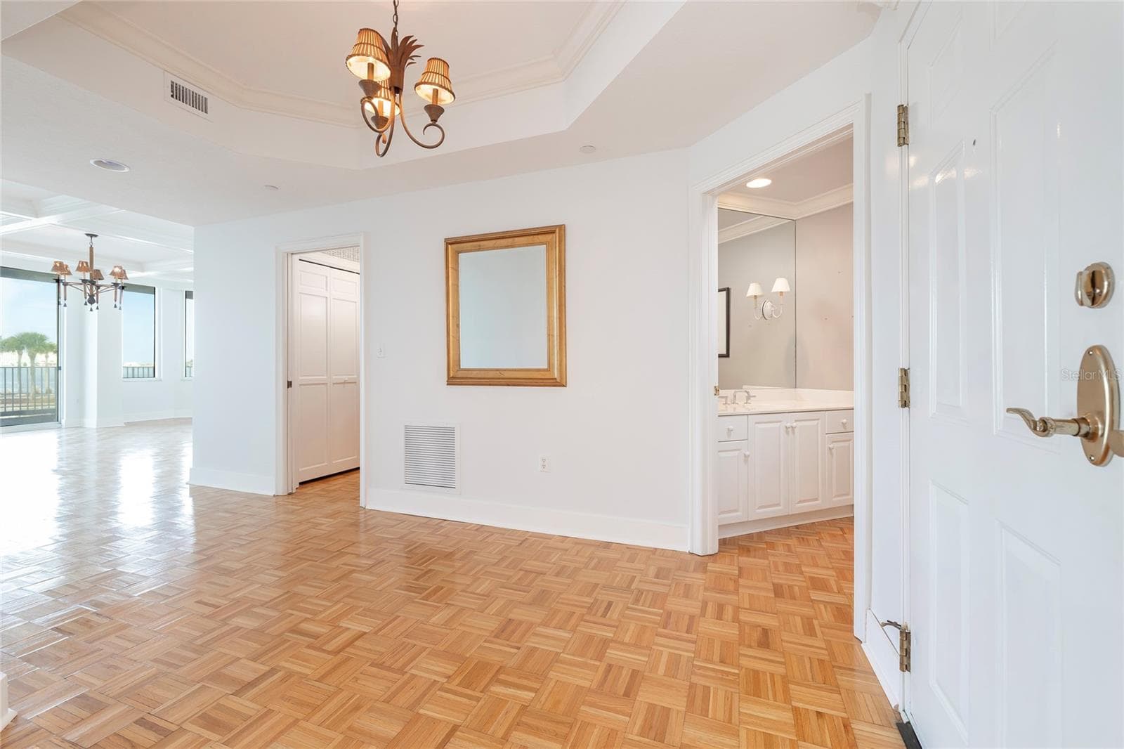 Foyer leading to Living Room (left) and Kitchen (right) - 2 SEASIDE LN #103, BELLEAIR
