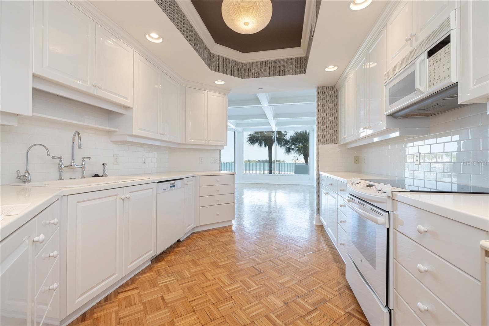 Kitchen overlooking the Dining Room - 2 SEASIDE LN #103, BELLEAIR