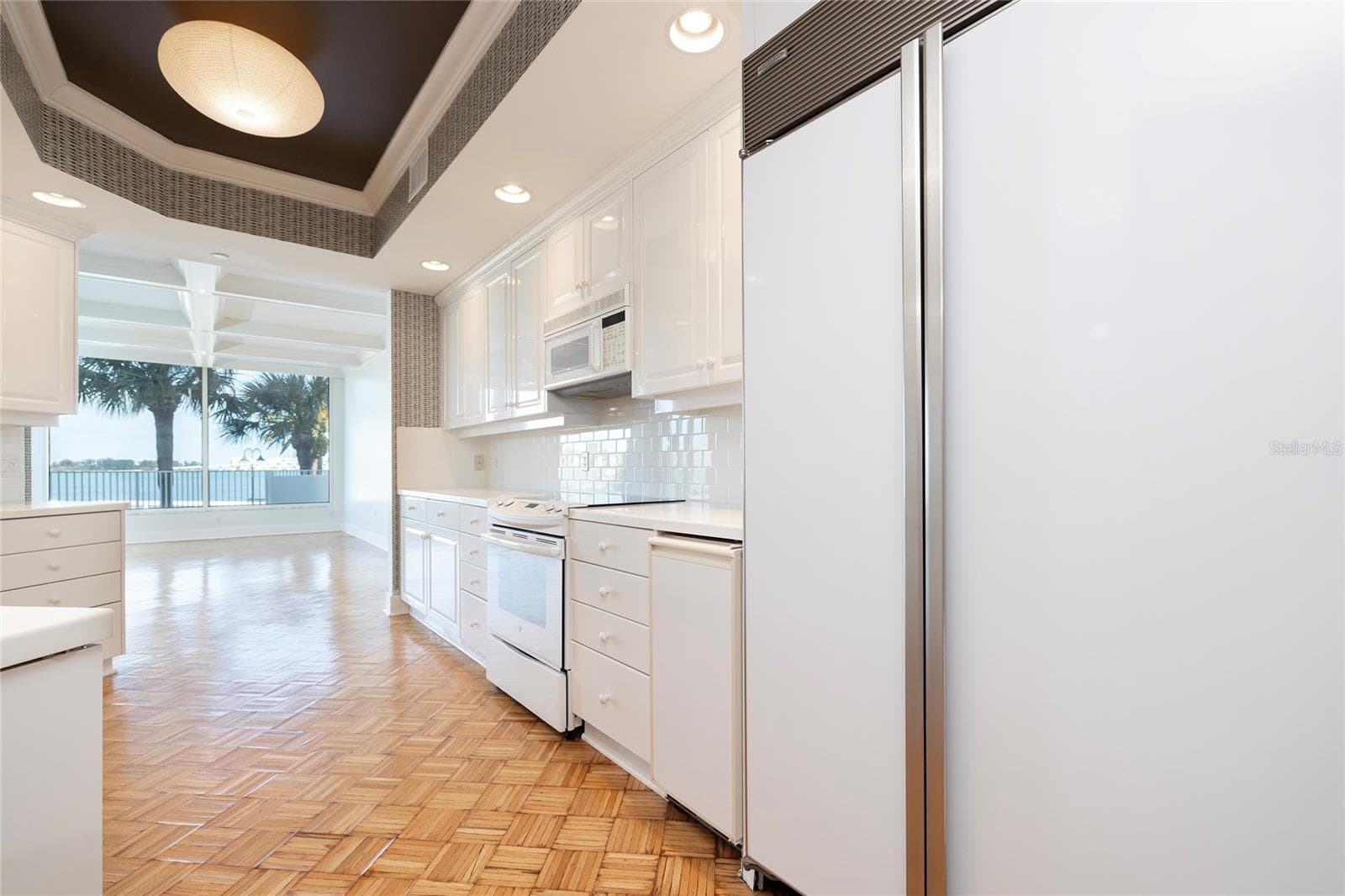 Kitchen overlooking the Dining Room - 2 SEASIDE LN #103, BELLEAIR