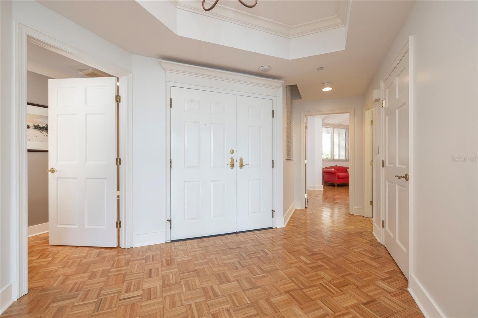 Foyer, Half Bath on left, Second Bedroom on right - 2 SEASIDE LN #103, BELLEAIR