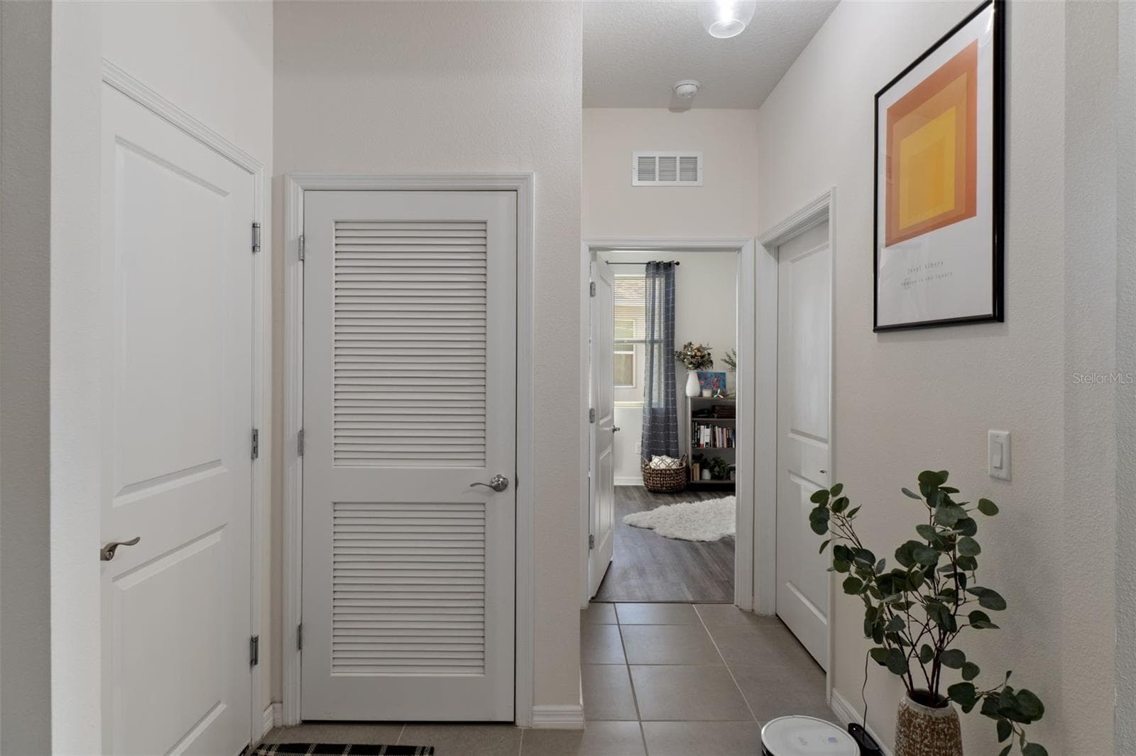 entrance to laundry and 4th bedroom to the left is garage entrance-very convenient. - 17807 GARSALASO CIR, BROOKSVILLE