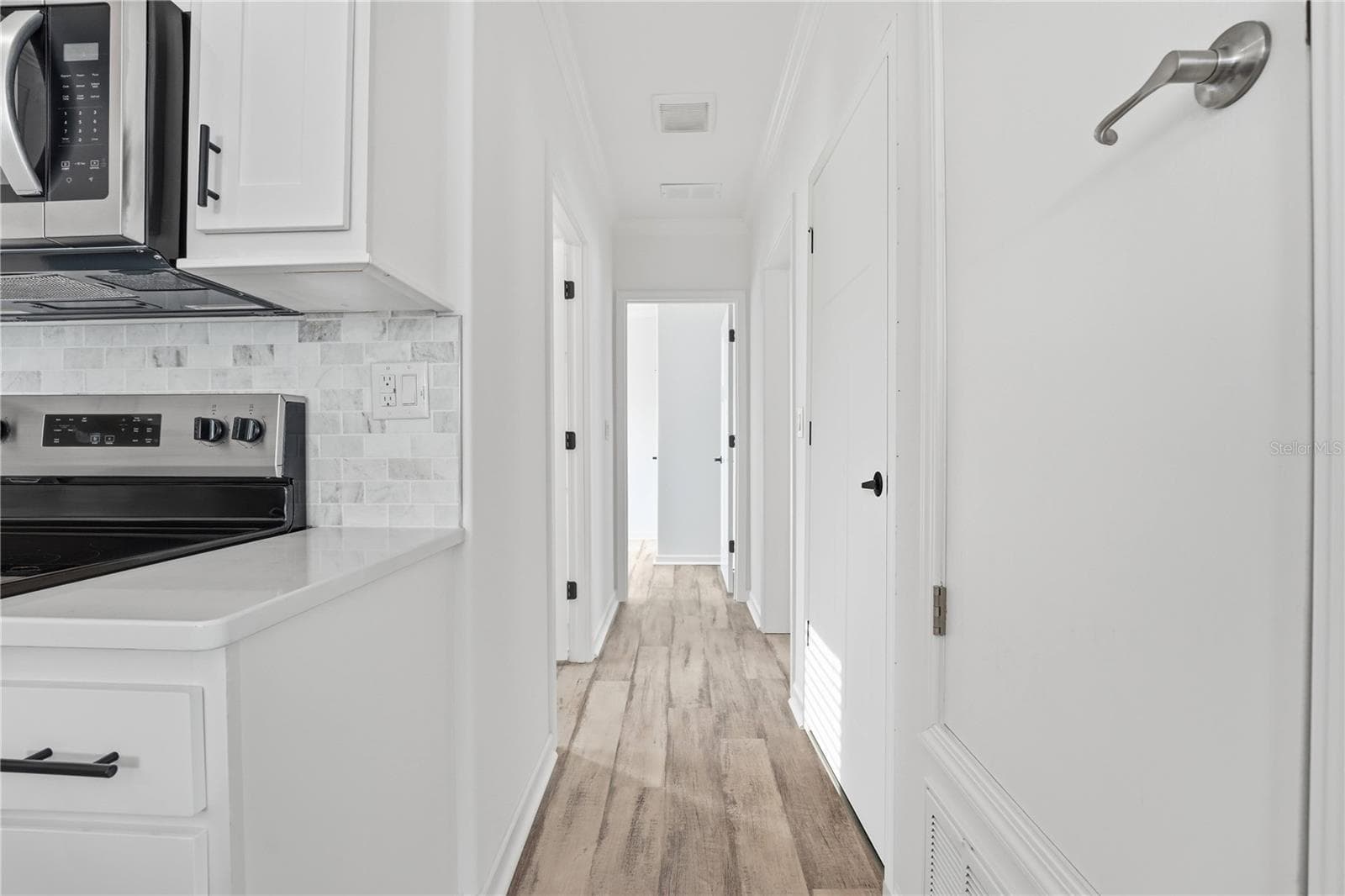Hallway to bedrooms - 3710 GULF OF MEXICO DR #F2, LONGBOAT KEY