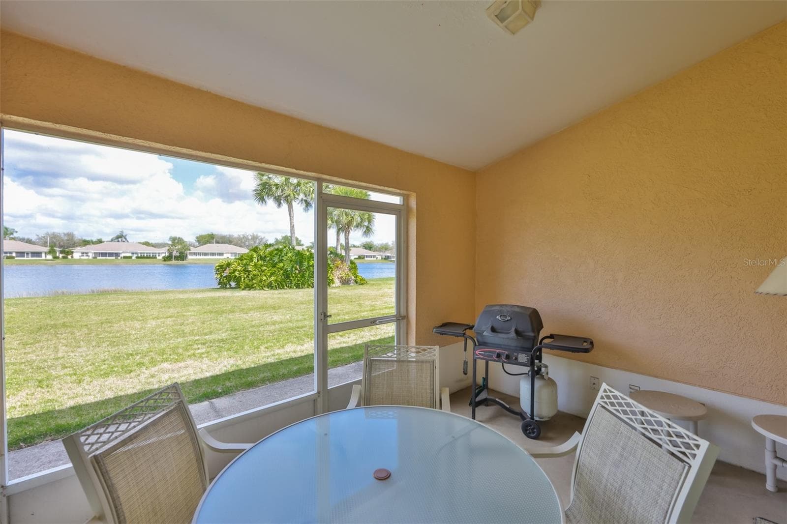 ENJOY THE VIEW FROM YOUR SCREENED LANAI, PERFECT FOR YOUR MORNING COFFEE OR EVENING BBQ'S - 2308 BROOKFIELD GREENS CIR, SUN CITY CENTER