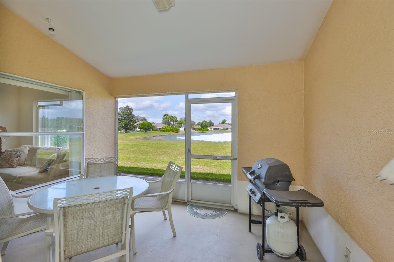 LANAI LOOKING INTO OFFICE/DEN AND WHAT A VIEW. - 2308 BROOKFIELD GREENS CIR, SUN CITY CENTER