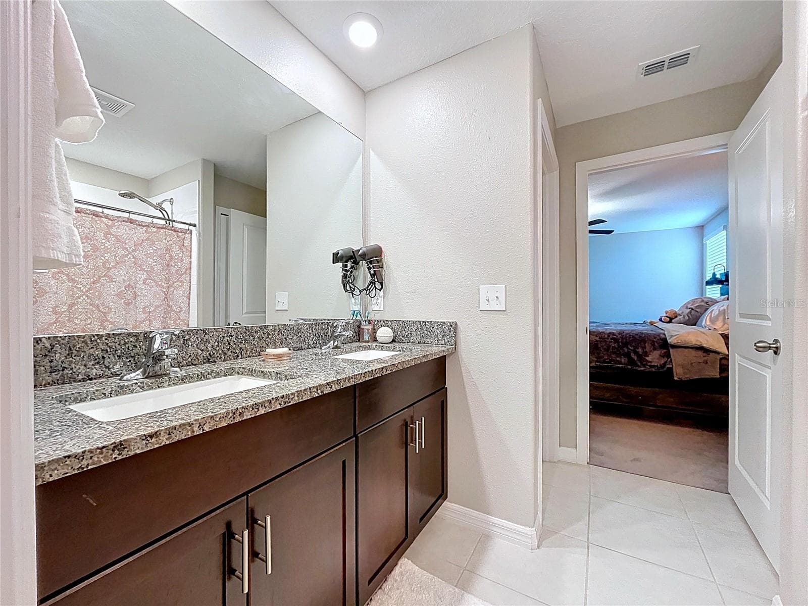Primary bathroom has double sinks, and thick granite, and plenty of storage! - 3141 OYSTER COVE ST, WIMAUMA