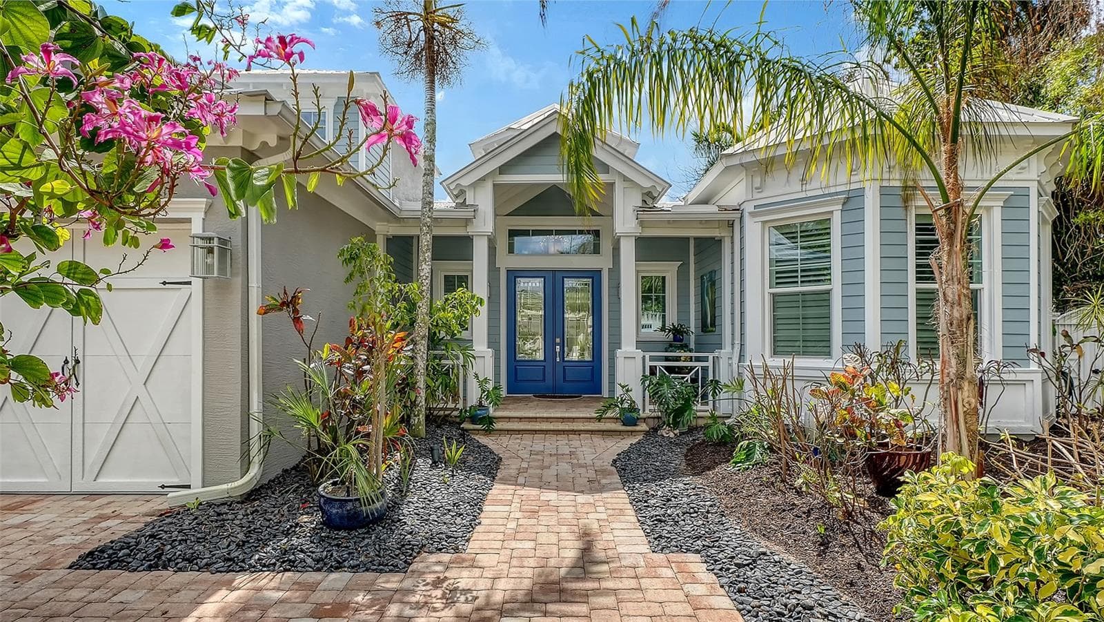 The paver driveway and walkway lead to a welcoming double French door entry - 1794 CUNLIFF LN, SARASOTA