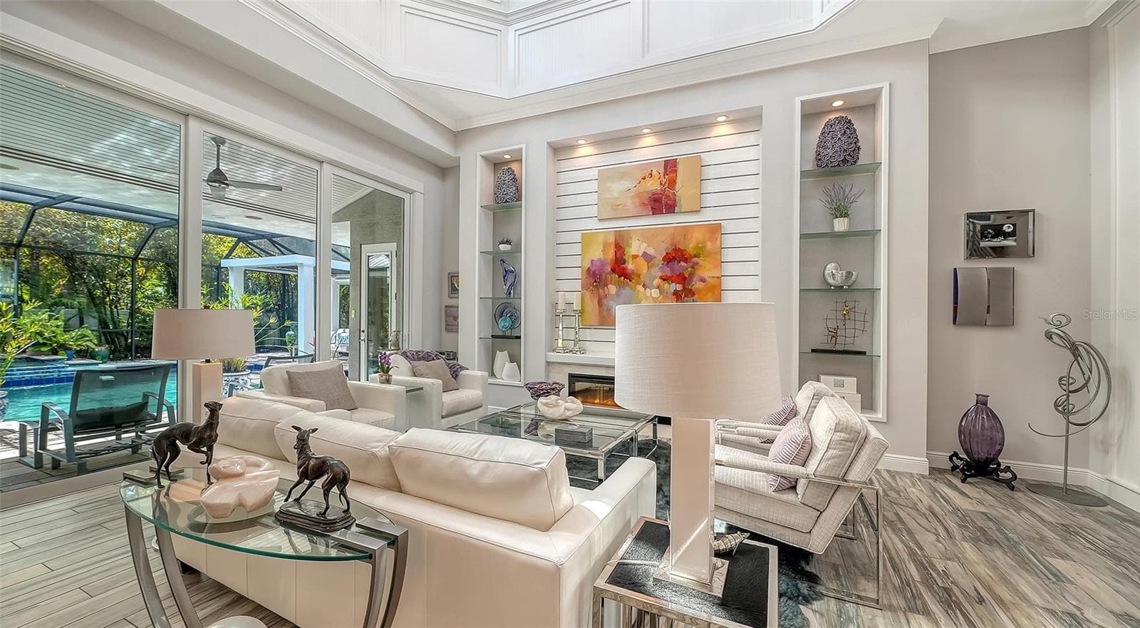 Soaring ceilings and custom millwork are features of the great room of this spectacular home - 1794 CUNLIFF LN, SARASOTA